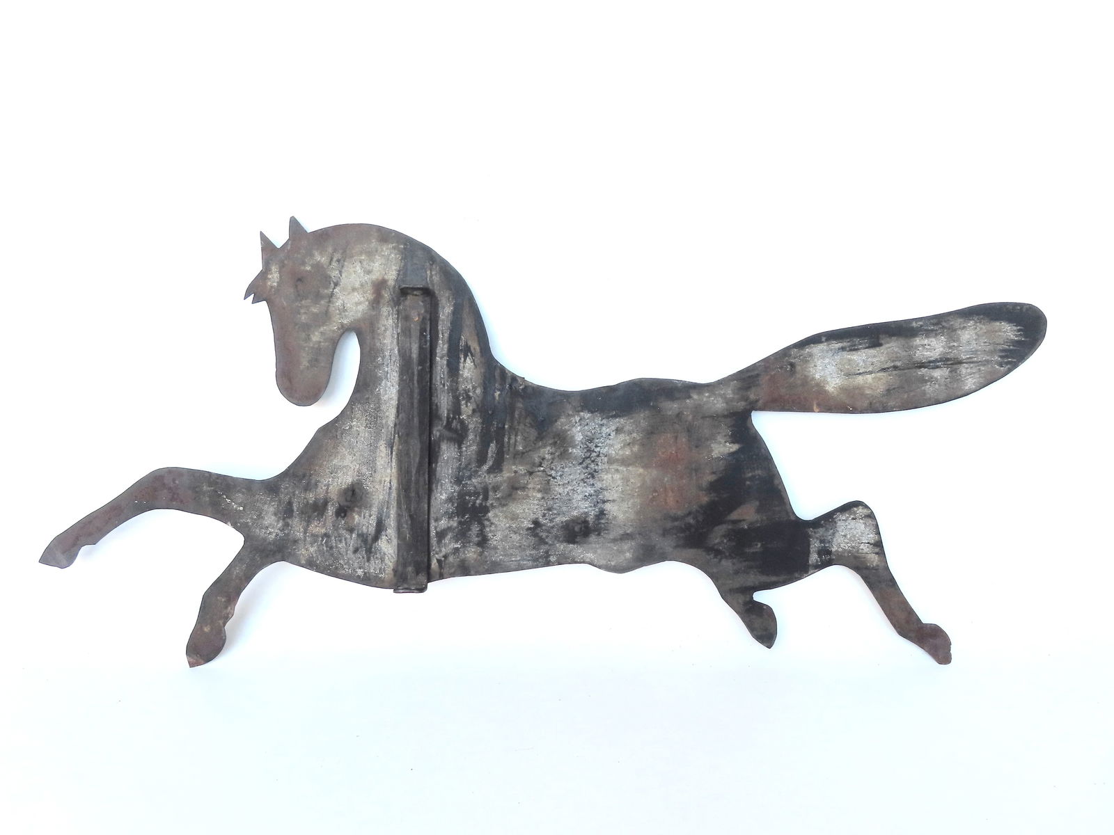 A silhouette sheet iron leaping horse weathervane, traces of original gray paint, late 19th century.: A silhouette sheet iron leaping horse weathervane, traces of original gray paint, late 19th century. Two repaired bullet holes, otherwise in good condition. Measures 36"L x 15 1/4"H.
