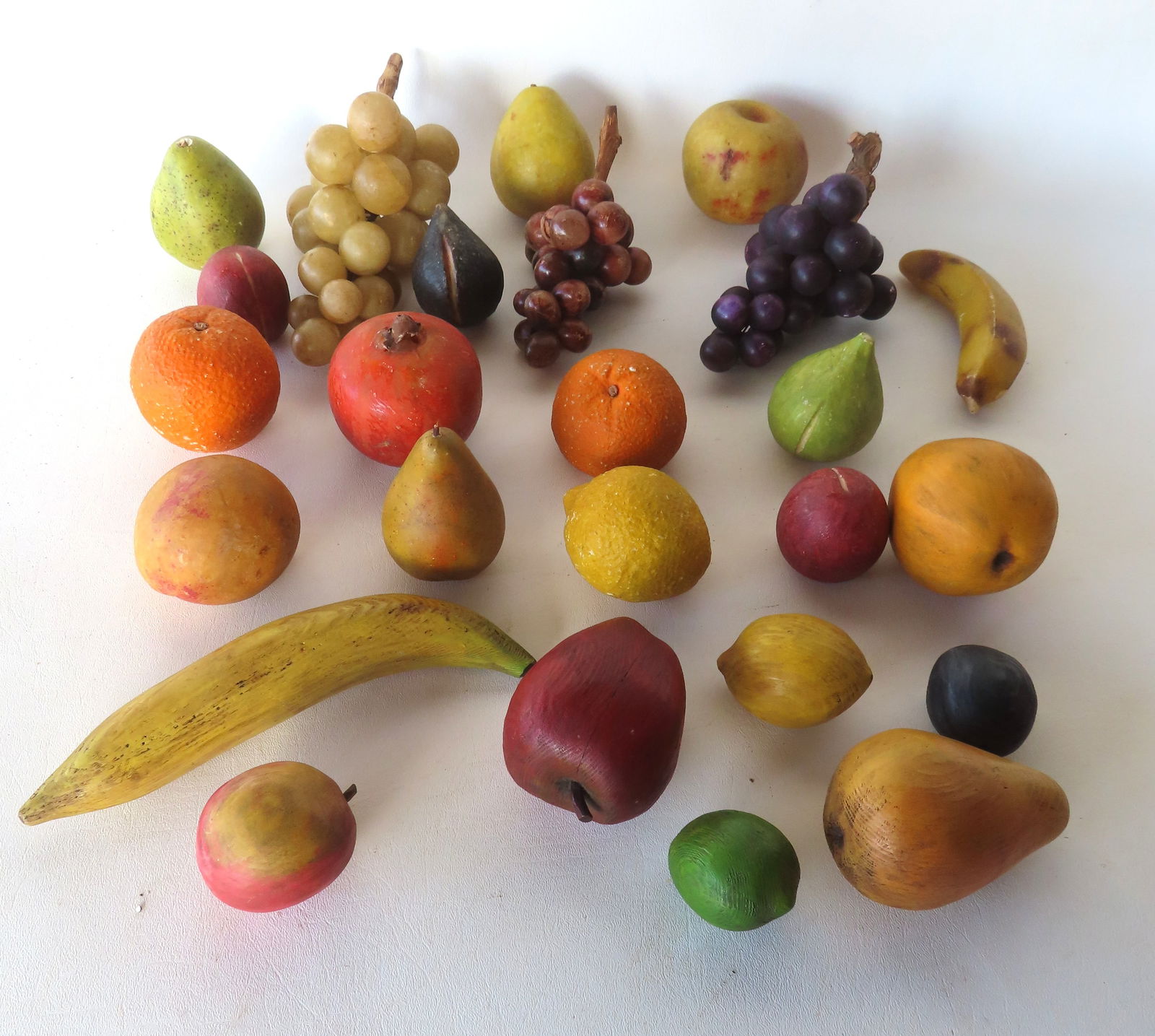 A grouping of 17 pieces of hand painted stone fruit circa 1950, and 7 pieces of carved painted (1 of 12)