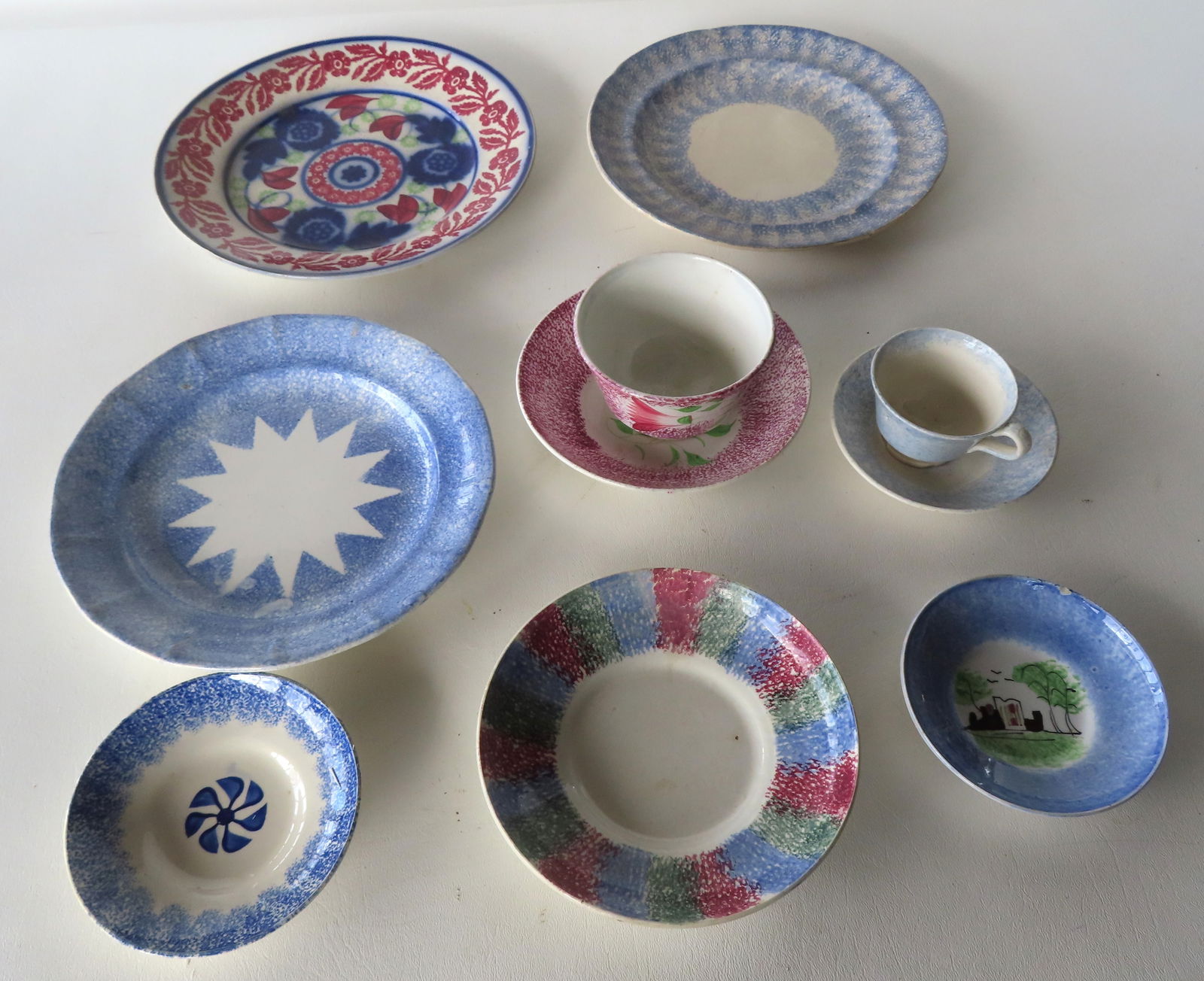 Grouping of 8 early pieces of mostly spatterware including a cup & saucer decorated with hand (1 of 17)