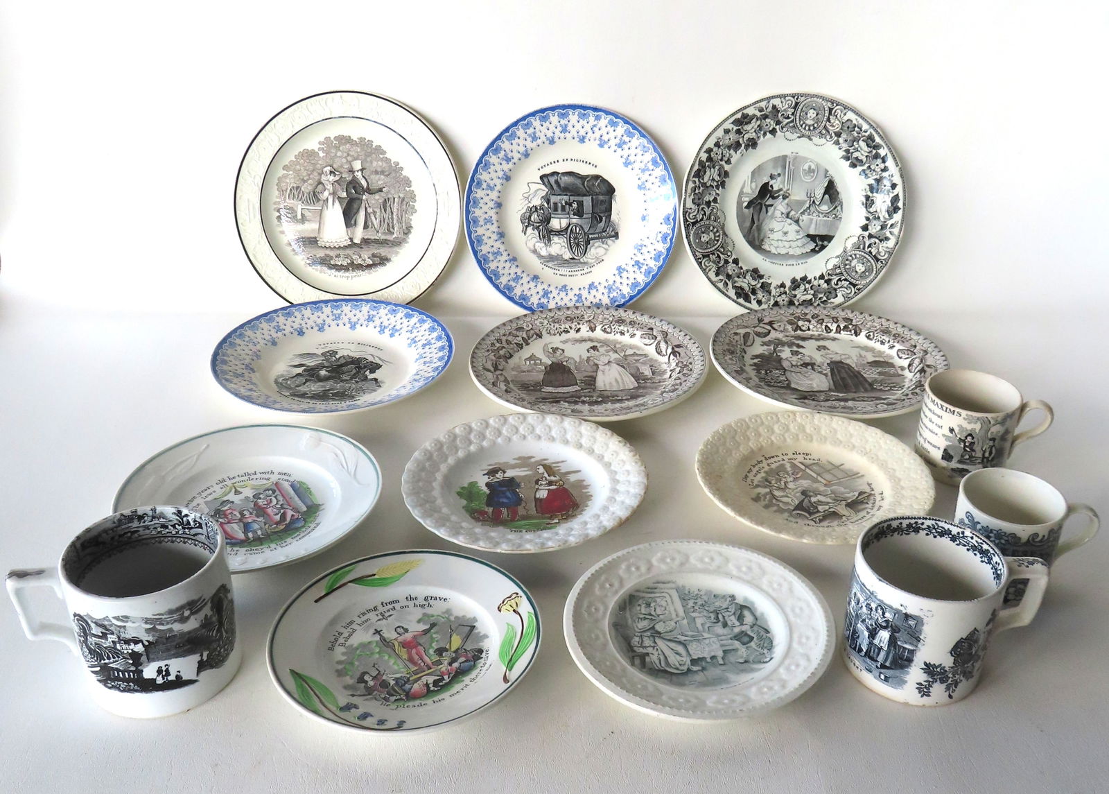 Grouping of 11 mostly motto transferware plates, and 4 cups, 19th century, including: Six French (1 of 20)