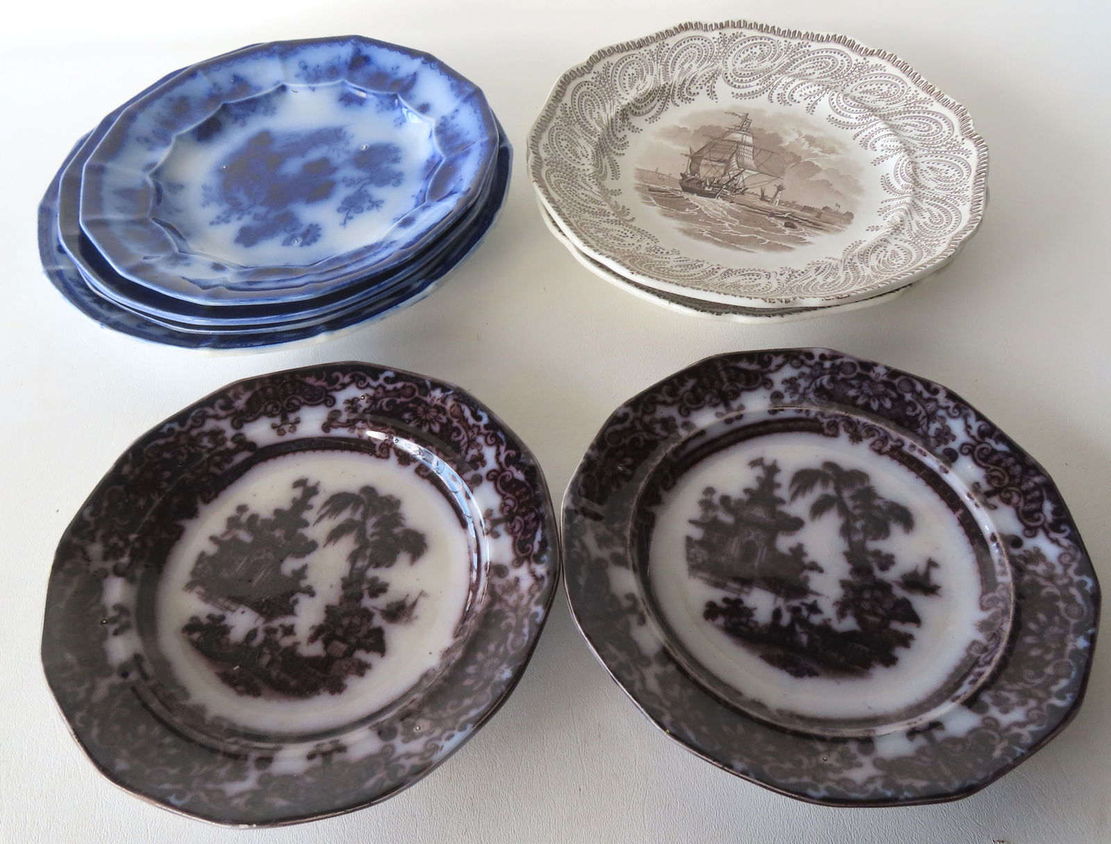 Grouping of 8 Staffordshire transferware plates including 4 in flow blue (various patterns - see (1 of 13)