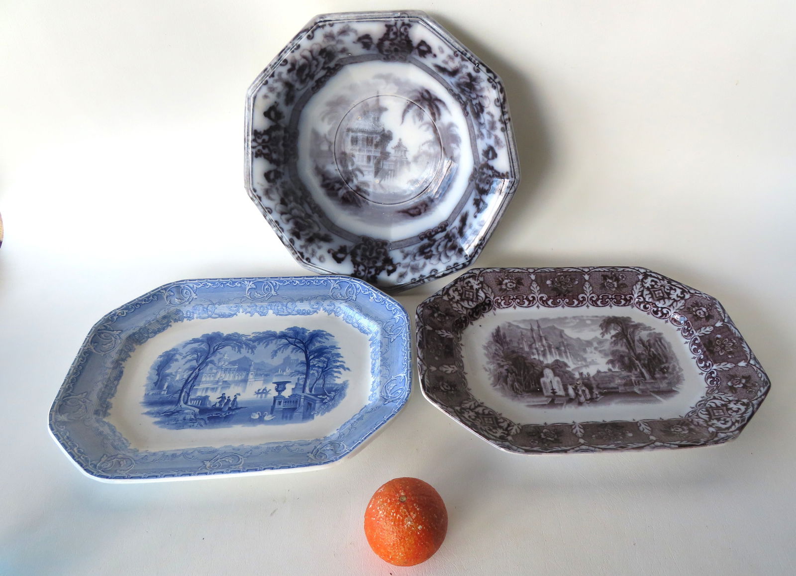Two Staffordshire transferware octagonal shaped platters and one bowl. The first platter in blue and: Two Staffordshire transferware octagonal shaped platters and one bowl. The first platter in blue and white in "Venus" pattern signed WC & Co., circa 1850 - very good condition, no damage or repairs -