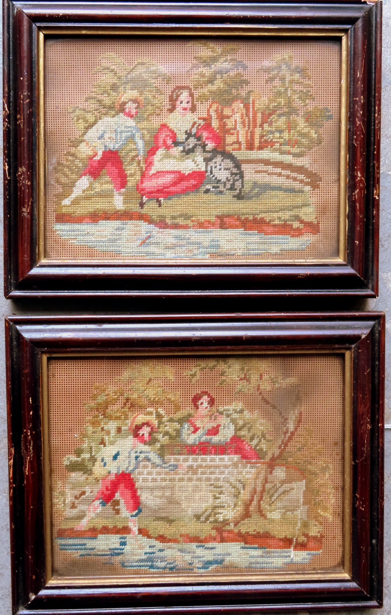 A pair of matching needlepoint wool-work pictures, hand sewn into paper patterns, circa 1850-60. The: A pair of matching needlepoint wool-work pictures, hand sewn into paper patterns, circa 1850-60. The first depicting a young man holding goose and a young girl petting deer - castle in background; the