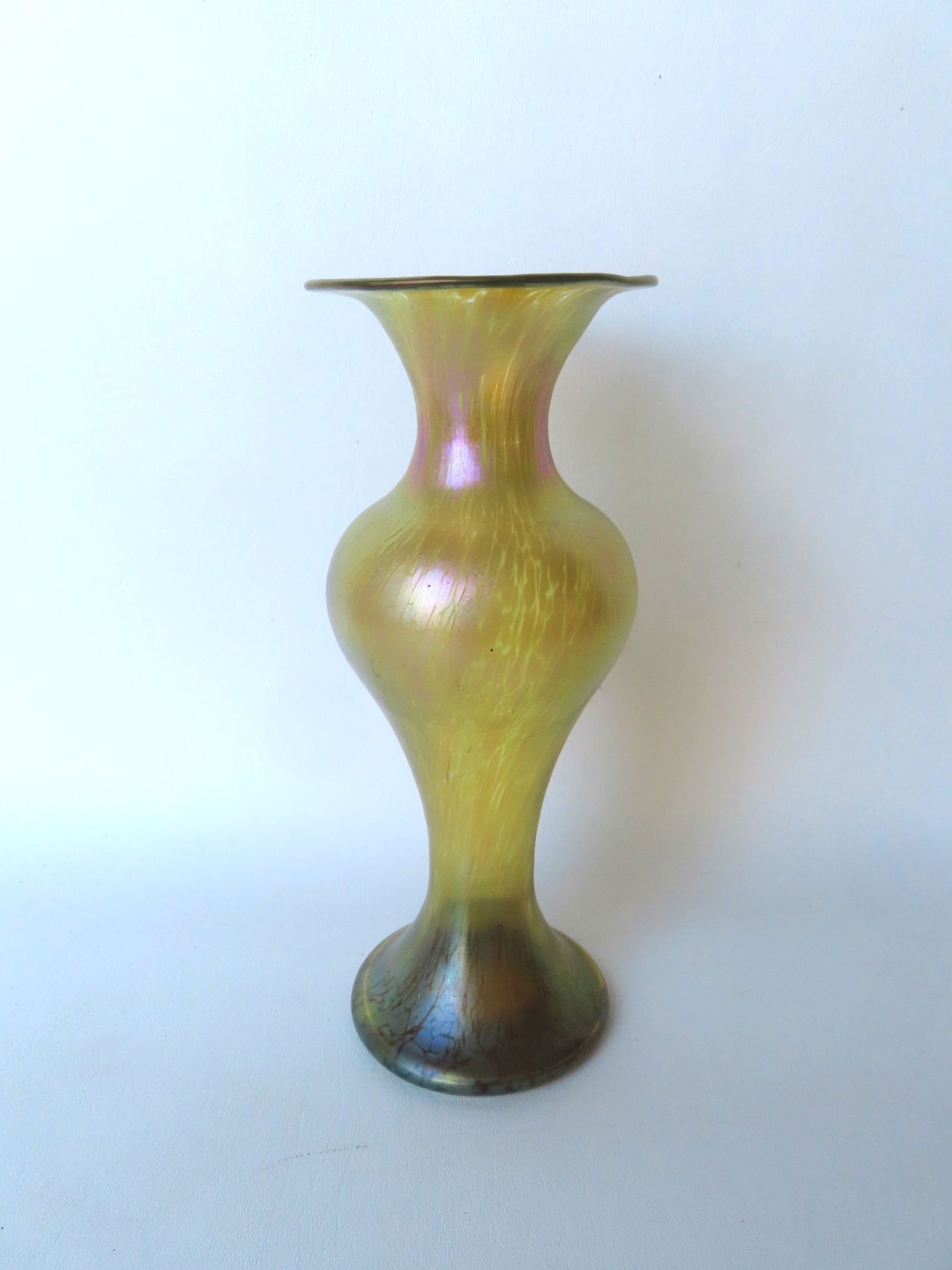 An unsigned gold iridescent Art Glass baluster form vase with flared rim and polished pontil on (1 of 4)