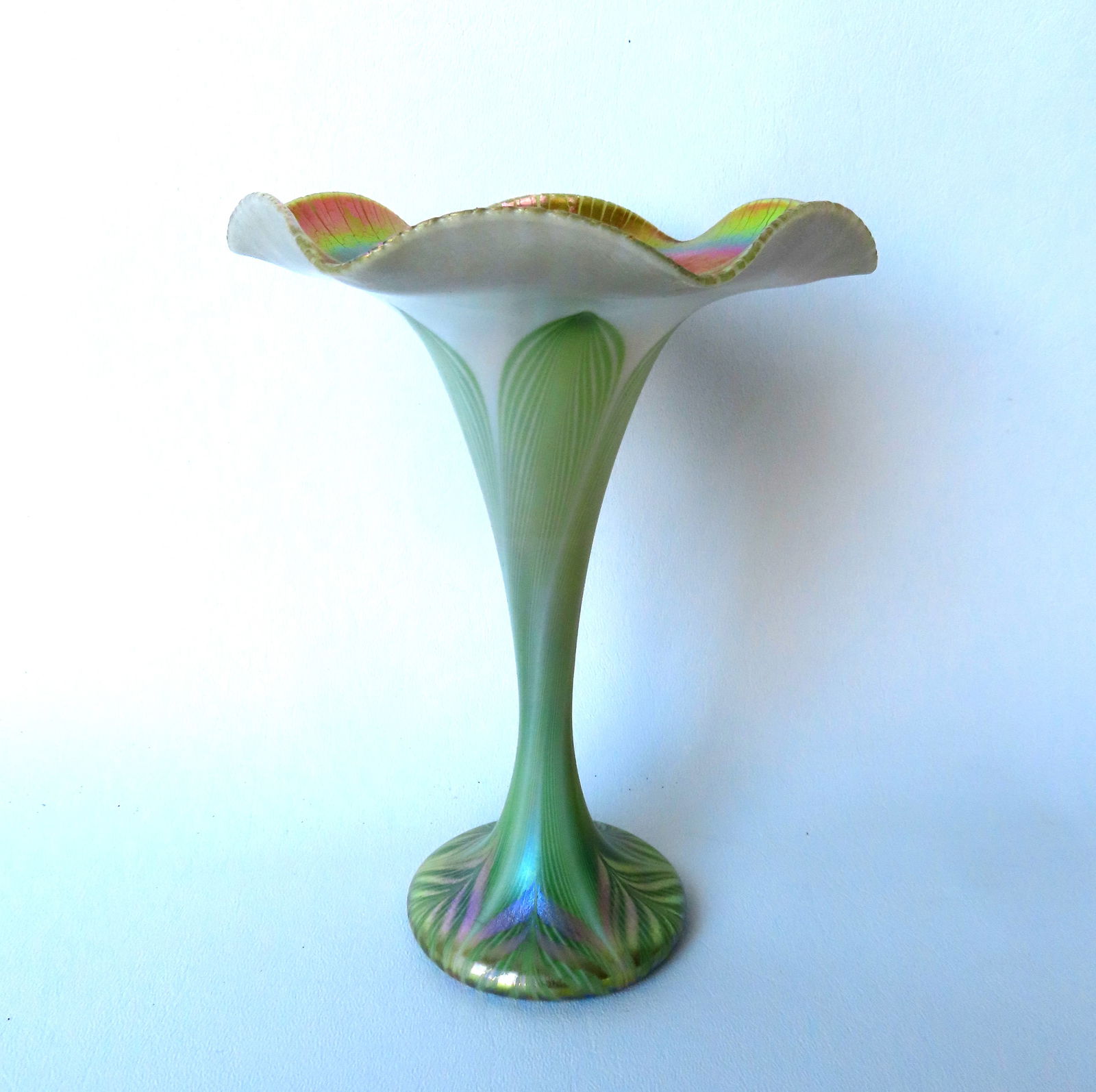 A Quezal gold iridescent pulled feather trumpet vase with ruffled edge, signed within pontil "Quezal (1 of 7)