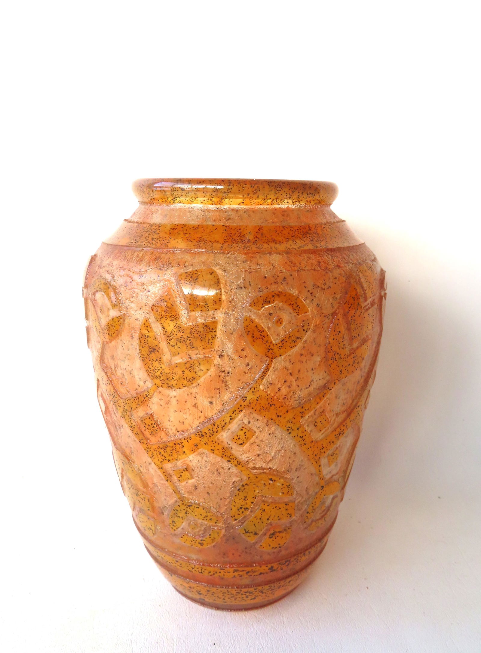 A signed "Daum Nancy / France" yellow-brown acid etched glass vase decorated with stylized flowers: A signed "Daum Nancy / France" yellow-brown acid etched glass vase decorated with stylized flowers with cross of Lorraine mark, circa 1925-30. Excellent condition, no damage. Measures 9 3/4"H x 6"W. P