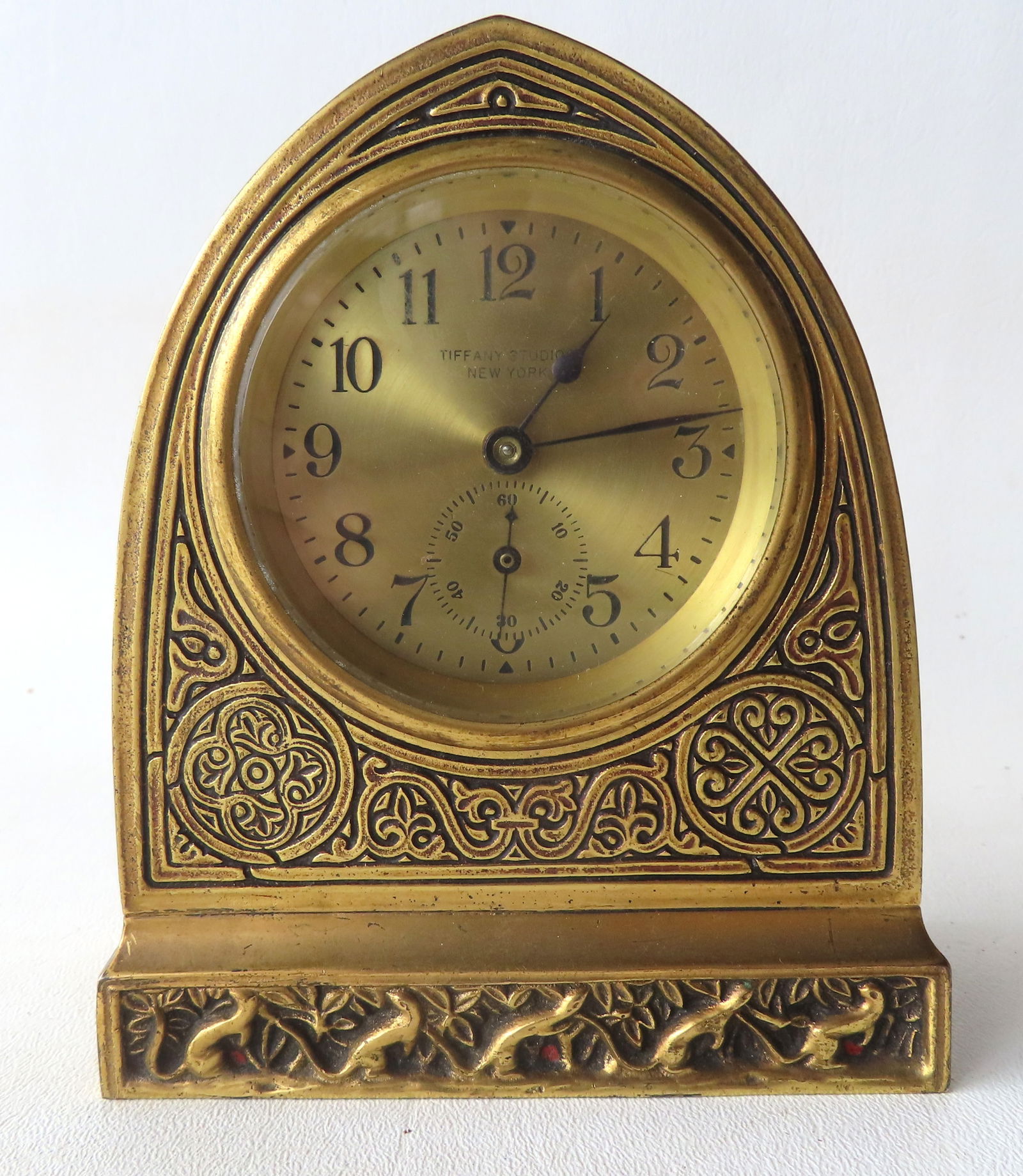 Tiffany Studios gilt bronze desk clock in the Venetian pattern with arched top, early 20th century -: Tiffany Studios gilt bronze desk clock in the Venetian pattern with arched top, early 20th century - the back door and base are signed "Tiffany Studios / New York / 1851" (1851 being the model number)