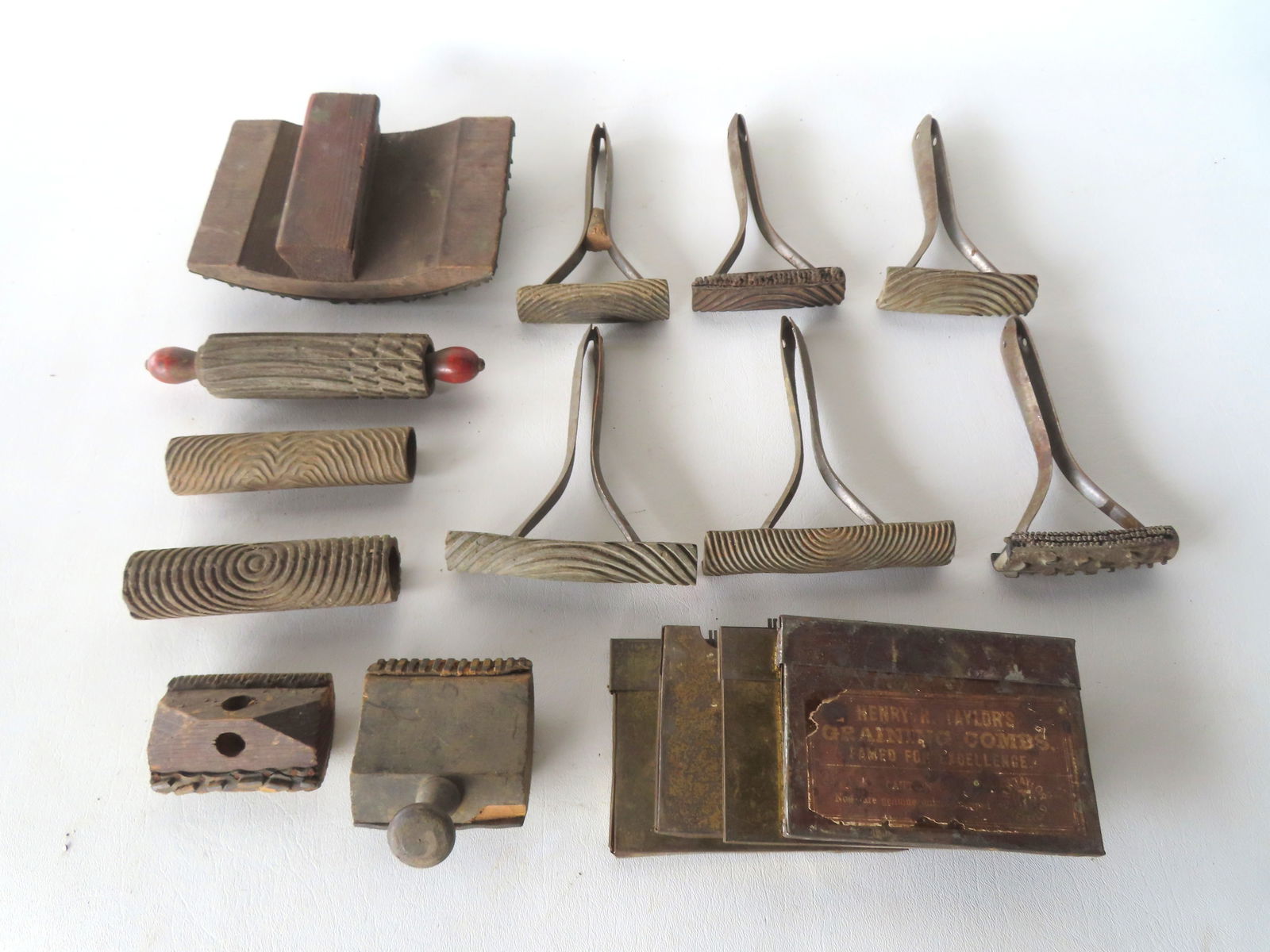 A collection of vintage grain painting tools, early 20th century. Includes 4 boxes of metal graining: A collection of vintage grain painting tools, early 20th century. Includes 4 boxes of metal graining combs (2 signed Henry H. Taylor, Sheffield England and 2 signed Ridgley - Warranted English Blue St