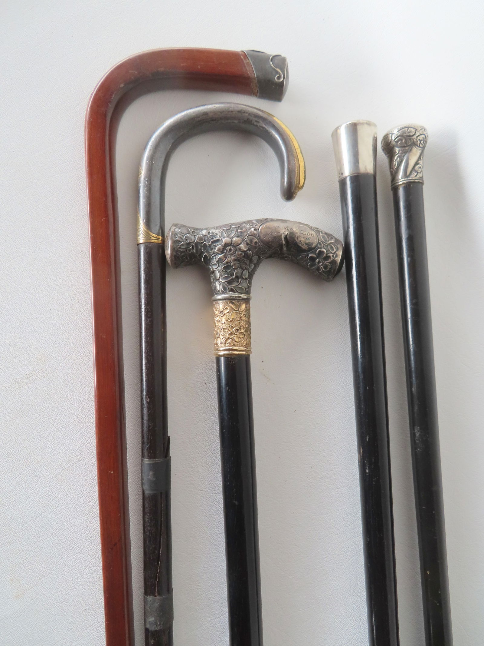 Grouping of 5 walking sticks, late 19th to early 20th century. 1) Presentation cane with ebony shaft (1 of 20)