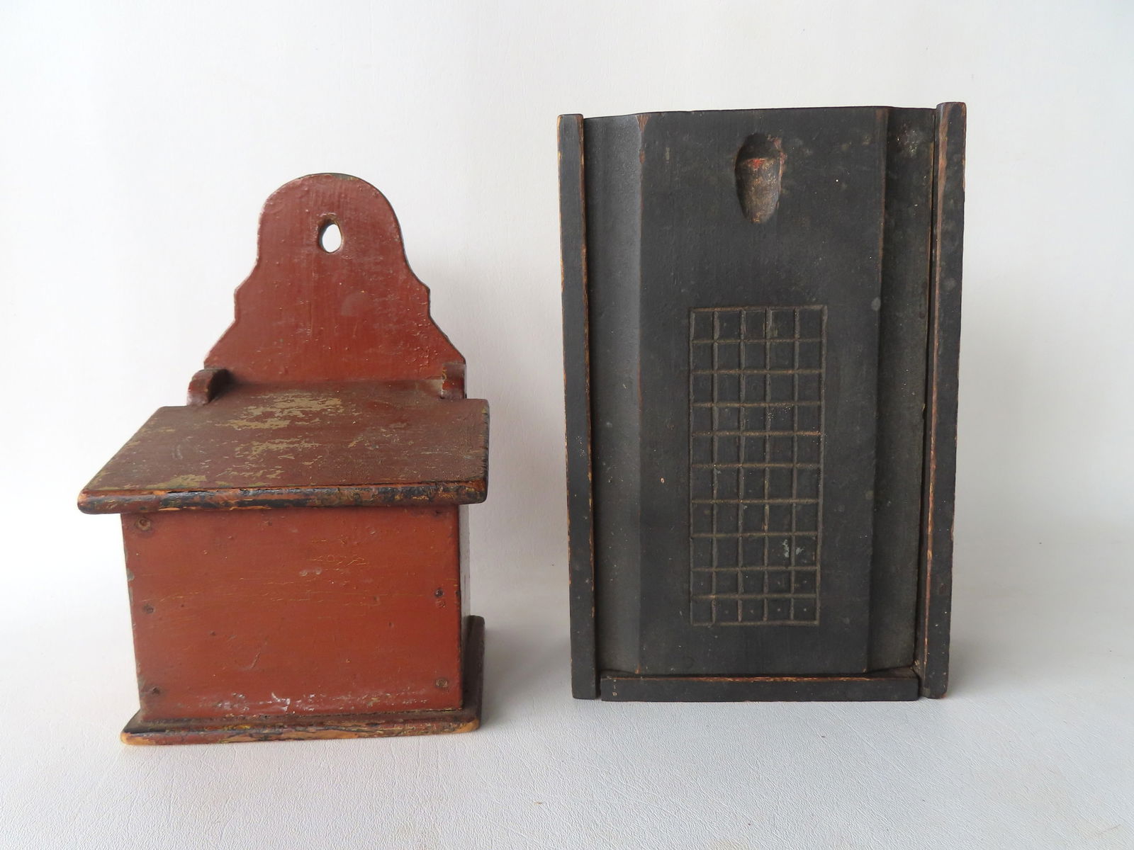 Two country kitchen collectibles, circa mid 19th century. The first, a good country slide lid box in: Two country kitchen collectibles, circa mid 19th century. The first, a good country slide lid box in original black paint with incised decorations, early to mid 19th century - 11"L x 7"W x 3 1/2"H - s