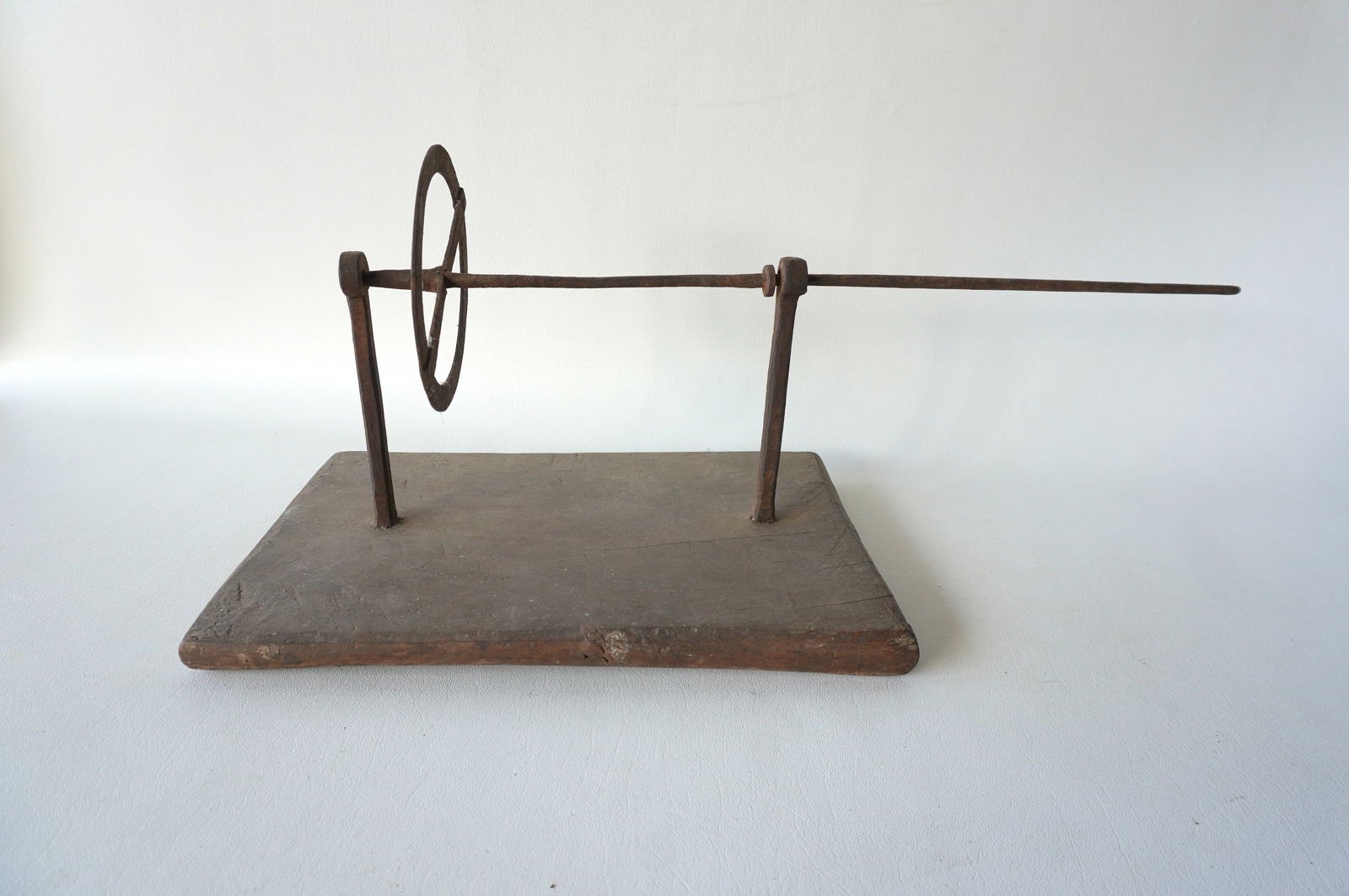 An early 18th century hand driven and hand forged revolving iron tool attached to its original (1 of 4)