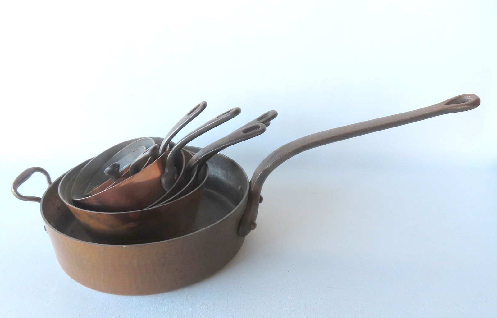 Grouping of 8 high quality copper frying pans with applied cast iron handles, all French 20th (1 of 11)