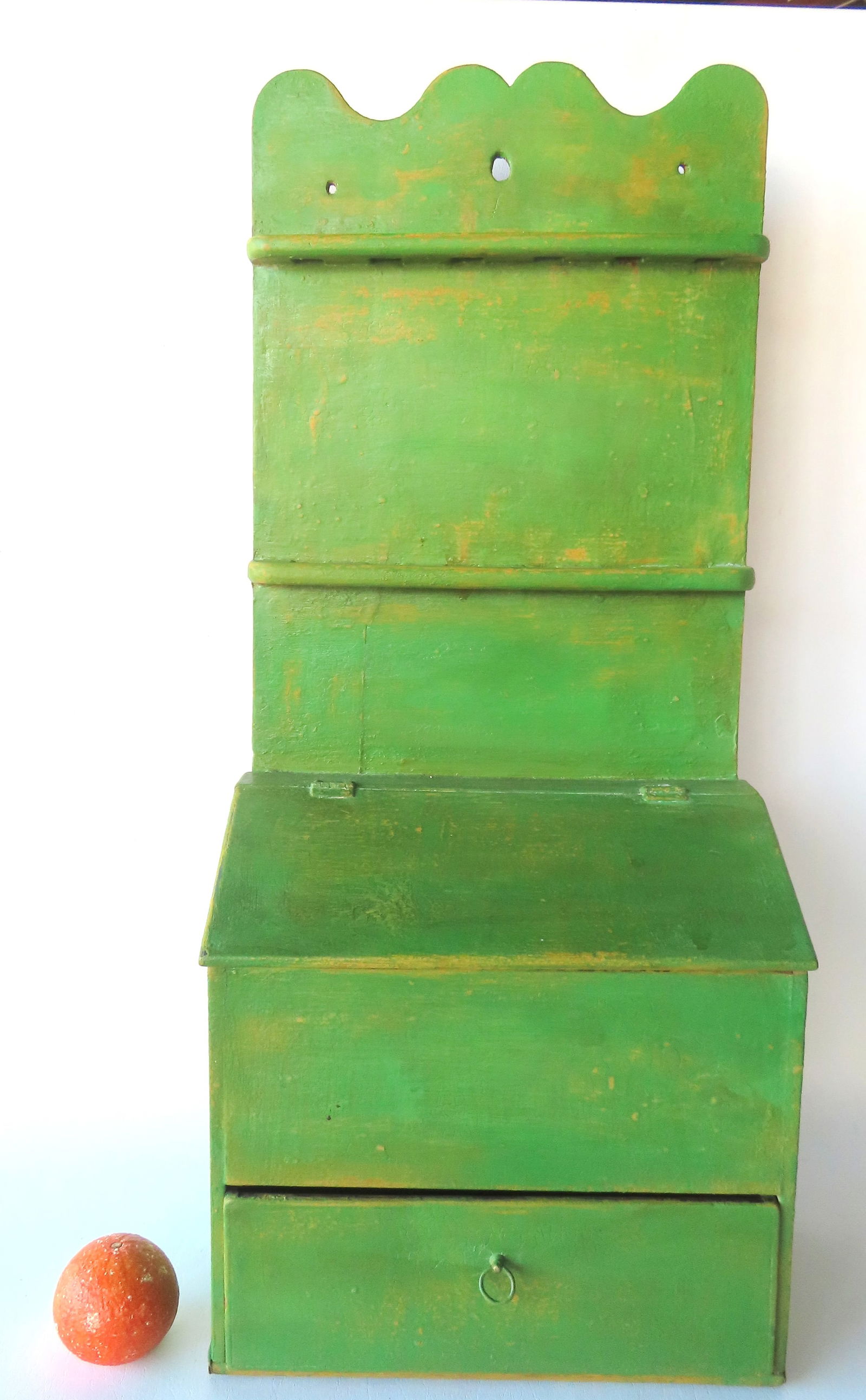 A large unusual early wall mounted spoon rack with built-in cutlery or salt box above lower drawer: A large unusual early wall mounted spoon rack with built-in cutlery or salt box above lower drawer with very fine dovetailing and having a shaped crest, early 19th century. Newer green paint over orig