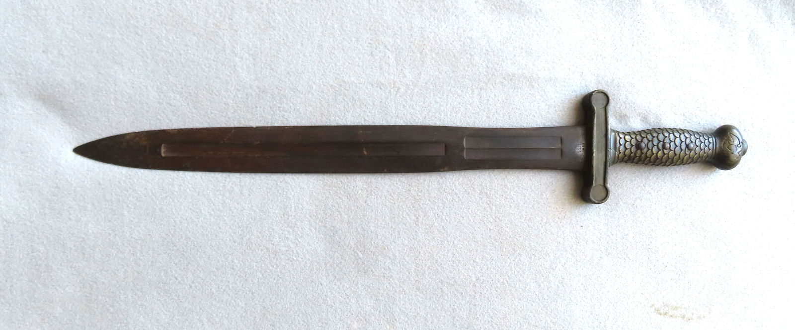 A U.S. Springfield Model 1832 Artillery Short Sword, marked on tang "UNITED STATES / 1833" and also: A U.S. Springfield Model 1832 Artillery Short Sword, marked on tang "UNITED STATES / 1833" and also faintly marked "N.P. Ames / Springfield" on the opposite side of tang. The sword with a fish-scale g