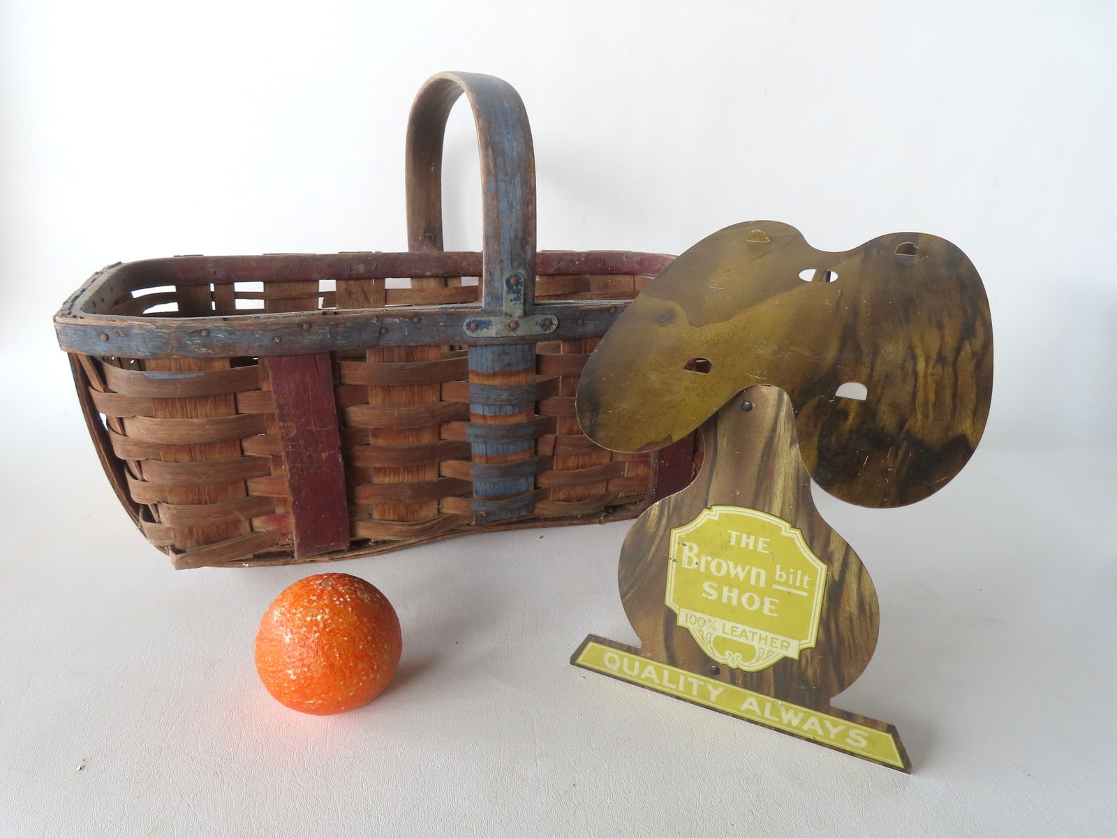 Two advertising items. The first a standup painted tin advertising display for "The Brown Bilt: Two advertising items. The first a standup painted tin advertising display for "The Brown Bilt Shoe", very good condition, probably early 20h century - measures 7 3/4"D x 7 1/2"W x 10"H; the second, a