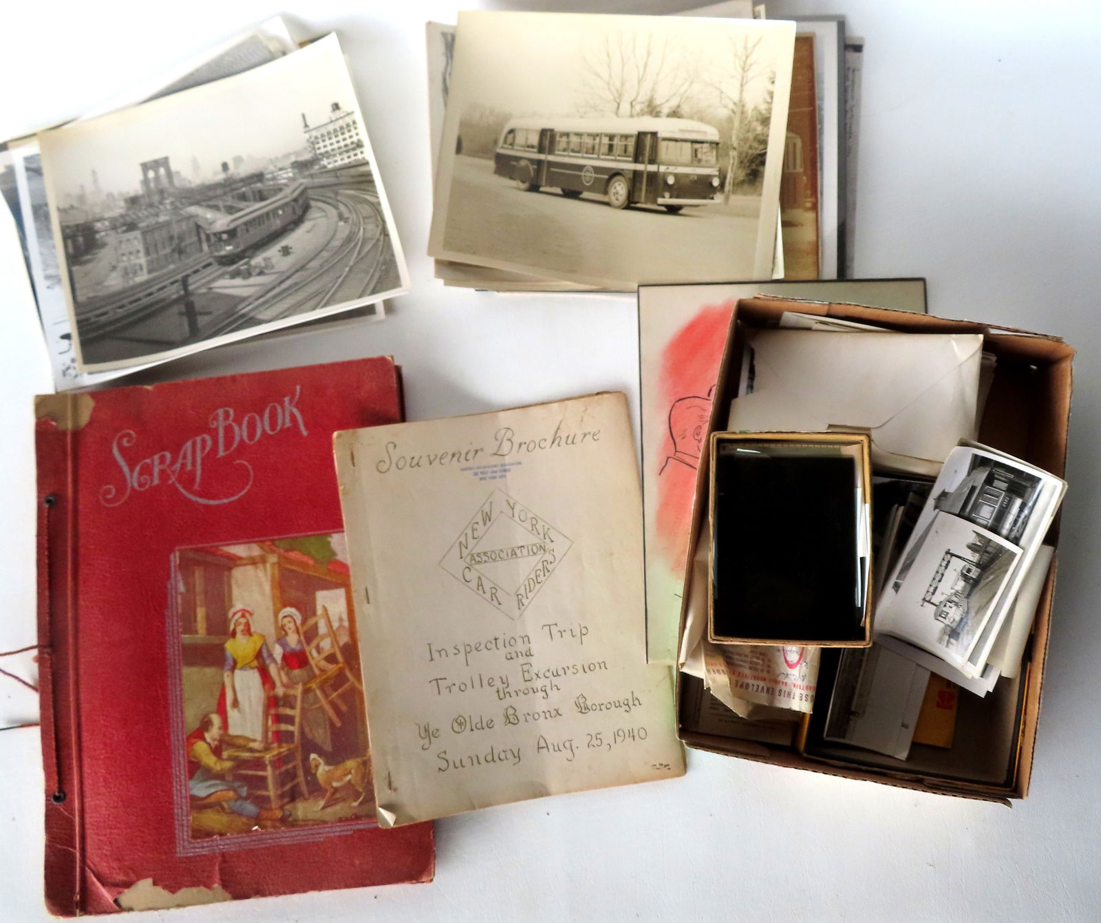 A large grouping of ephemera related to buses and trolley cars including photos, scrap book of: A large grouping of ephemera related to buses and trolley cars including photos, scrap book of transportation tickets from the 1930's, 14 photos of buses 1920-50 including Yonkers - most 8" x 10", 27