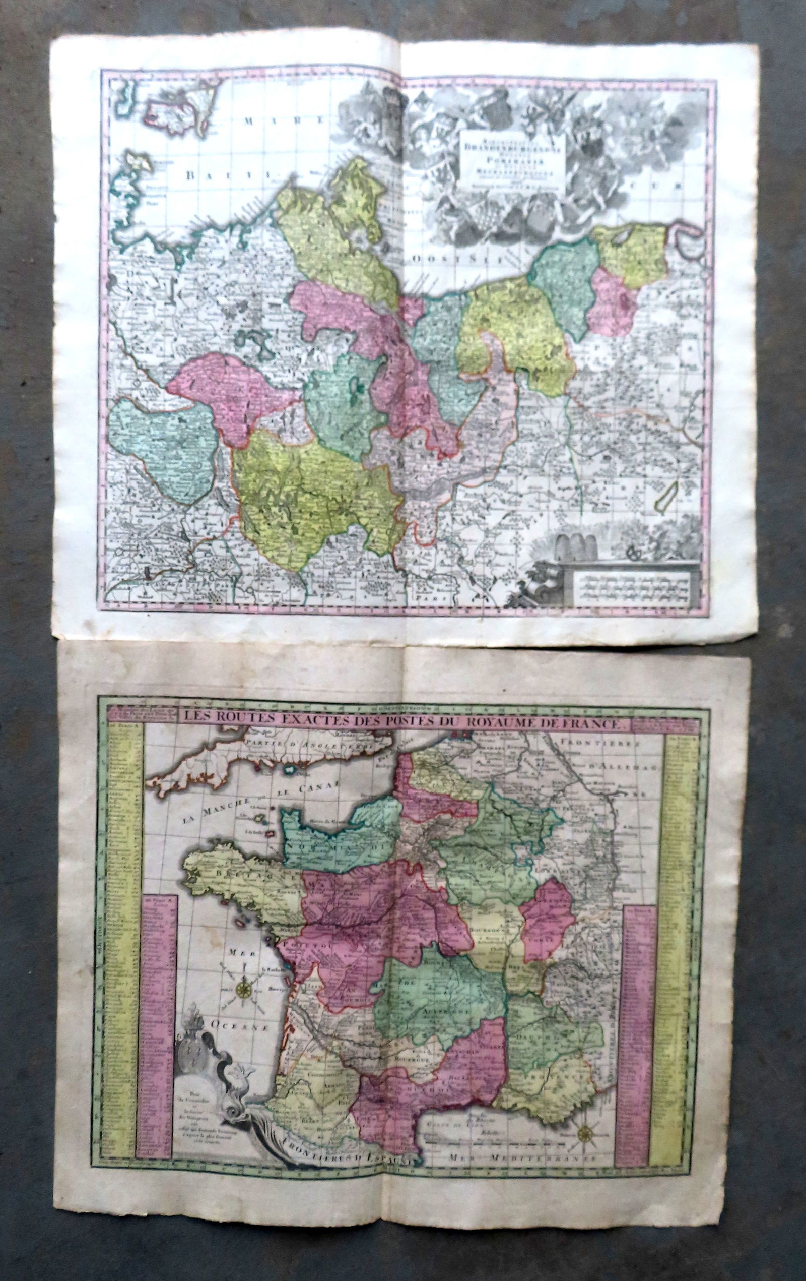 Two 18th century hand colored maps, each 25" x 21 3/4". The first titled "Les Routes Exactes Des: Two 18th century hand colored maps, each 25" x 21 3/4". The first titled "Les Routes Exactes Des Postes Du Royaume De France" translates to "The Exact Routes of the Posts of the Kingdom of France", by