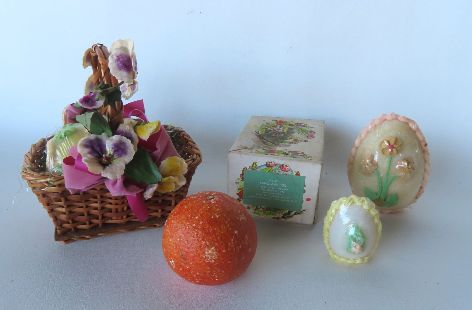 Four Peekaboo Easter sugar eggs, referred to by manufacturers as Panorama Eggs - each egg with a hol: Four Peekaboo Easter sugar eggs, referred to by manufacturers as Panorama Eggs - each egg with a hole in the base that one could look in to see children's Easter themes. The first is still sealed with