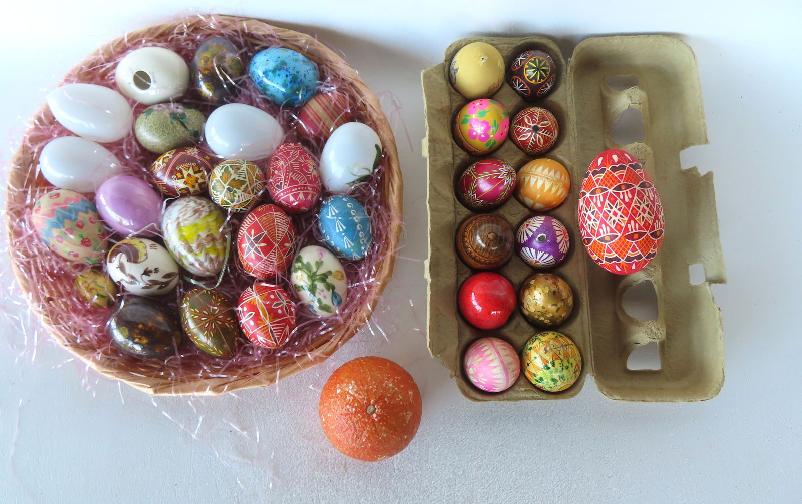 Grouping of 35 Easter eggs including: Four Victorian hand blown glass eggs - one of these is hand pa: Grouping of 35 Easter eggs including: Four Victorian hand blown glass eggs - one of these is hand painted - late 19th century; a cloisonne egg; many porcelain eggs, and many Ukrainian (or from that re