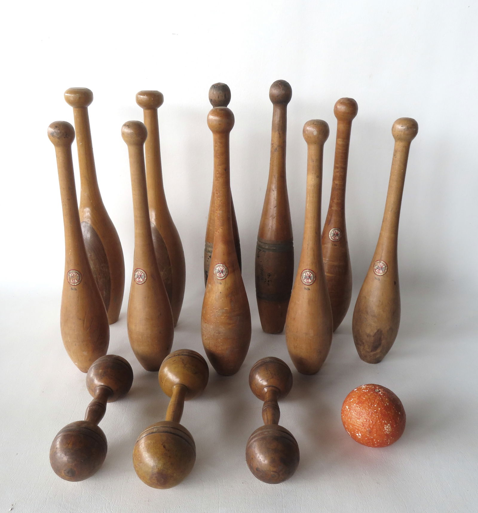 Grouping of 5 pairs of vintage maple Indian exercise clubs and 3 maple dumbells.: Grouping of 5 pairs of vintage maple Indian exercise clubs and 3 maple dumbells. Includes 1 pair in tiger maple signed "Narragansett Machine Co. / Providence R.I." each 1 pound; 2 pair of Narragansett