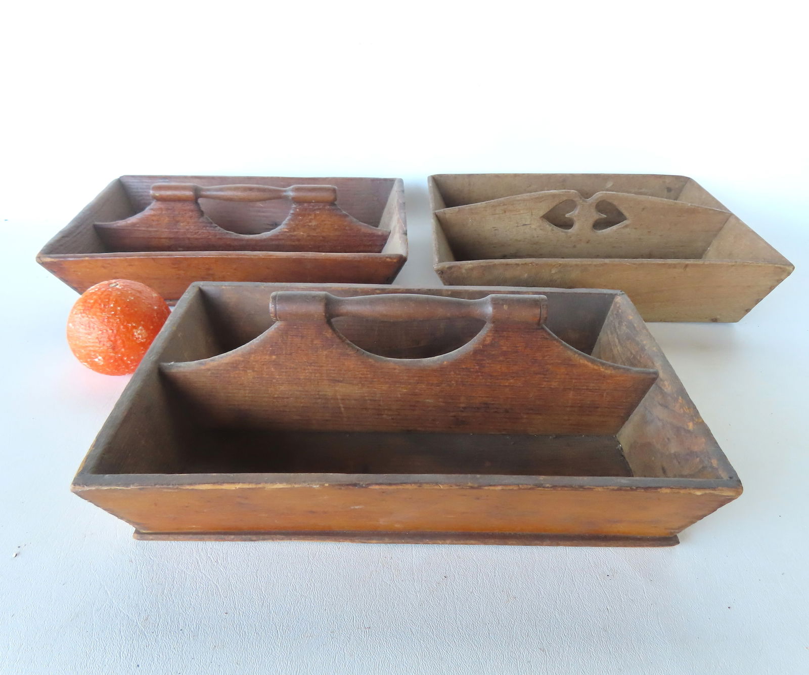 Three cutlery boxes in natural finish, one with double heart cutouts in handle, all 19th century in (1 of 7)