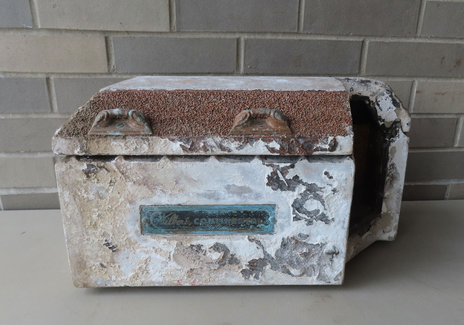 An unusual salesman sample burial vault in concrete/plaster with pebbled lid, with brass handles, si: An unusual salesman sample burial vault in concrete/plaster with pebbled lid, with brass or zinc handles, signed "Wilbert Continental" on brass plaque. Also marked "Trade Mark of Wilbert W. Haase Co."