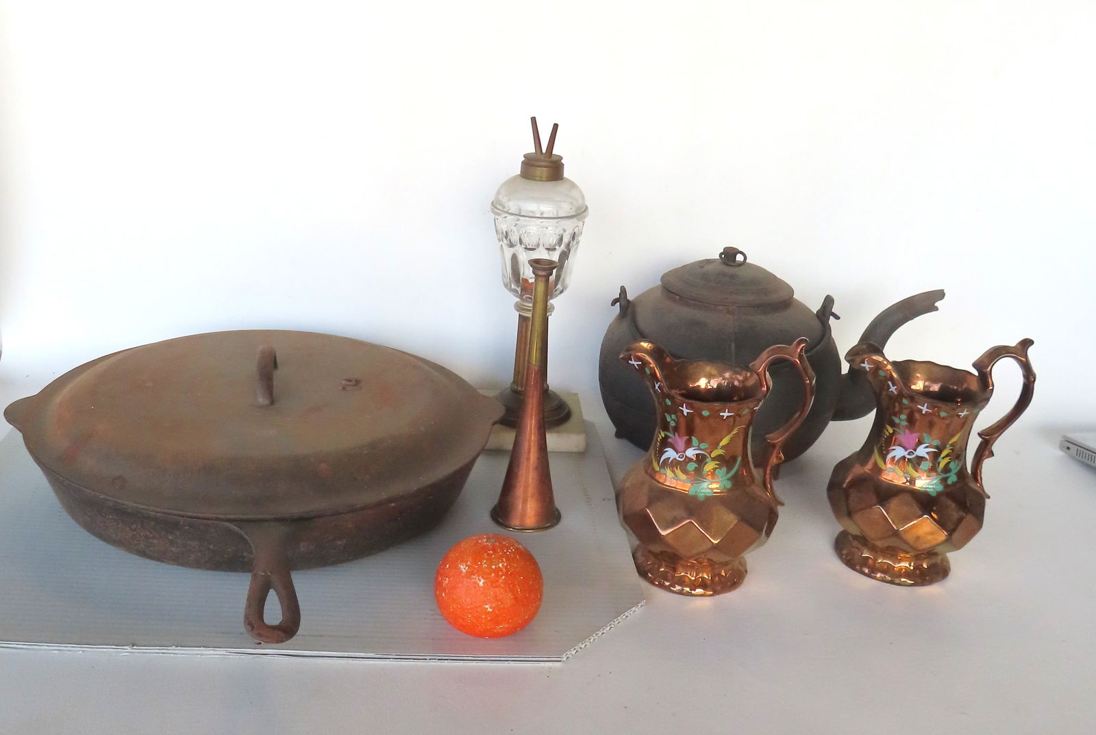 Grouping of country collectibles including: Whale oil lamp with fluted column leading to square marb: Grouping of country collectibles including: Whale oil lamp with fluted column leading to square marble base - 12"H; a small brass horse hunt horn - 8 3/4"L; 2 lusterware pitchers with hand painted dec