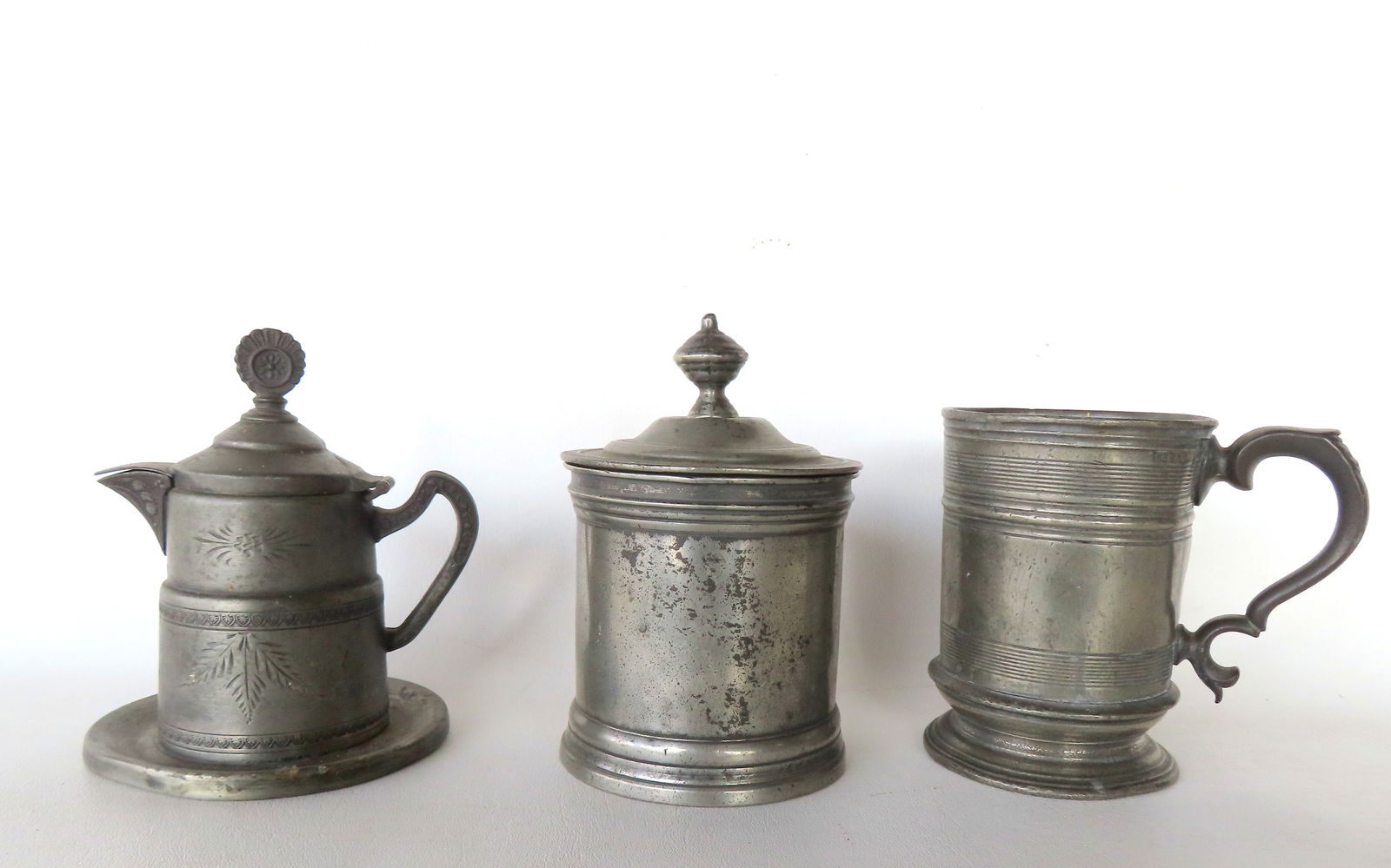 Three pieces of 19th century metal work, including: Pewter mug with touch marks and script inscripti: Three pieces of 19th century metal work, including: Pewter mug with touch marks and script inscription on base (see photos), probably early 19th century - good condition; lidded pewter bowl with remov