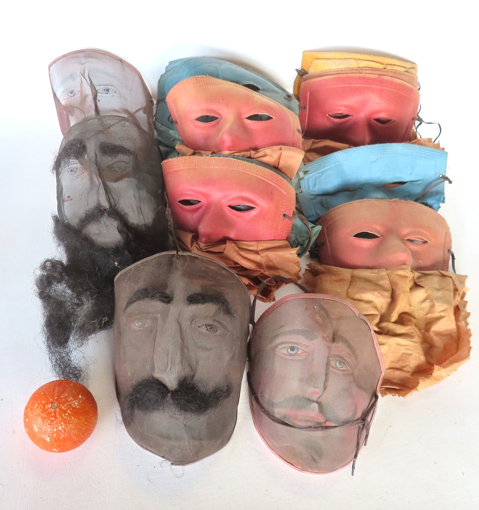 Grouping of 25 vintage theatrical and costume masks including: 4 vintage wire mesh masks with hand p: Grouping of 25 vintage theatrical and costume masks including: 4 vintage wire mesh masks with hand painted facial features, early to mid 20th century, all in used condition, maybe some hair loss to be