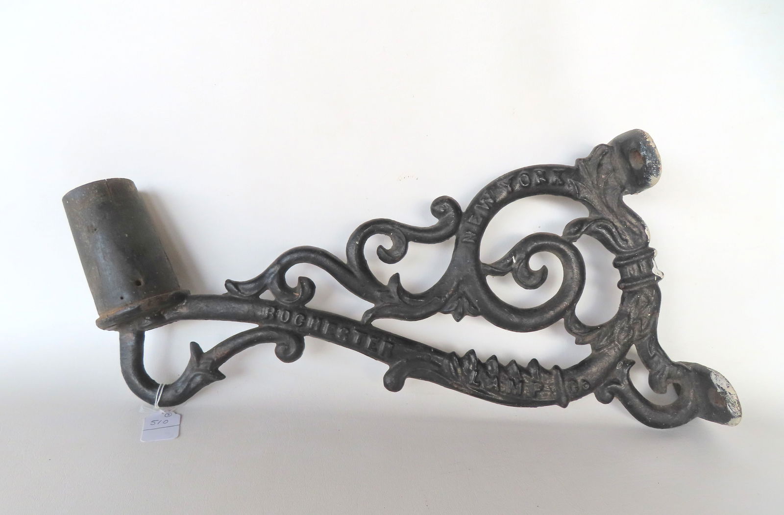 A rare cast iron street light holder signed Rochester Lamp Co. New York, 19th century in very good c: A rare cast iron street light holder signed Rochester Lamp Co. New York, 19th century in very good condition. Measures 19"L x 13 1/2"H x 4"D.
