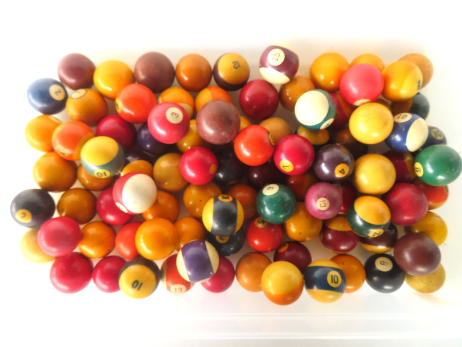 A collection of 90 vintage billiard and/or snooker balls, all used but in good condition - not sure: A collection of 90 vintage billiard and/or snooker balls, all used but in good condition - not sure if complete sets or not - see photos for further information.
