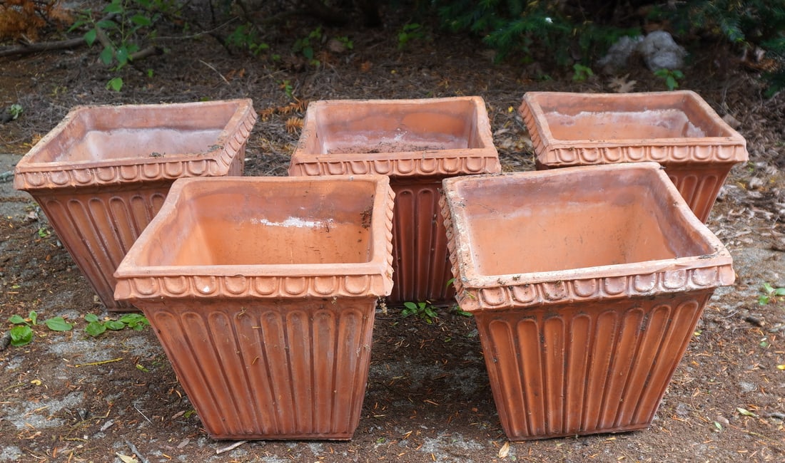 Grouping of 5 matching terra cotta flower pots, all with fluted and tapered sides and shaped rims, (1 of 5)