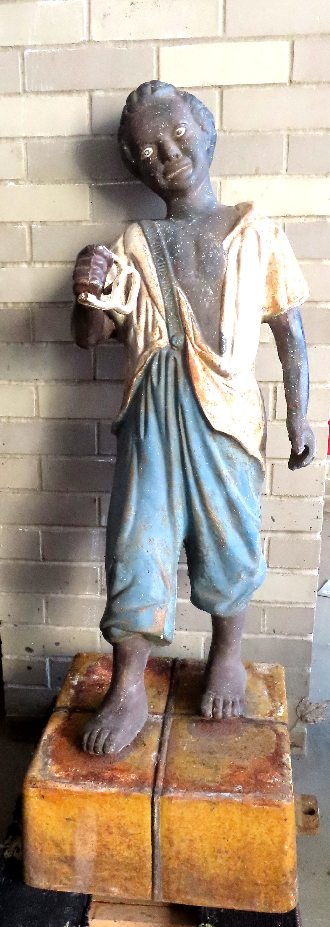 A large cast iron lawn jockey mounted on cast iron platform, in old paint. The figure itself (1 of 18)