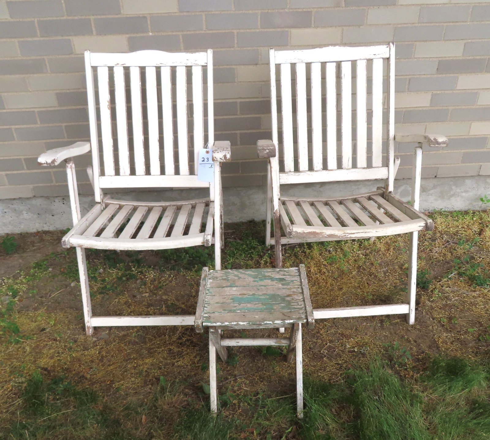 Two wooden folding beach or deck chairs and a folding occasional table, all in an old white paint (1 of 5)