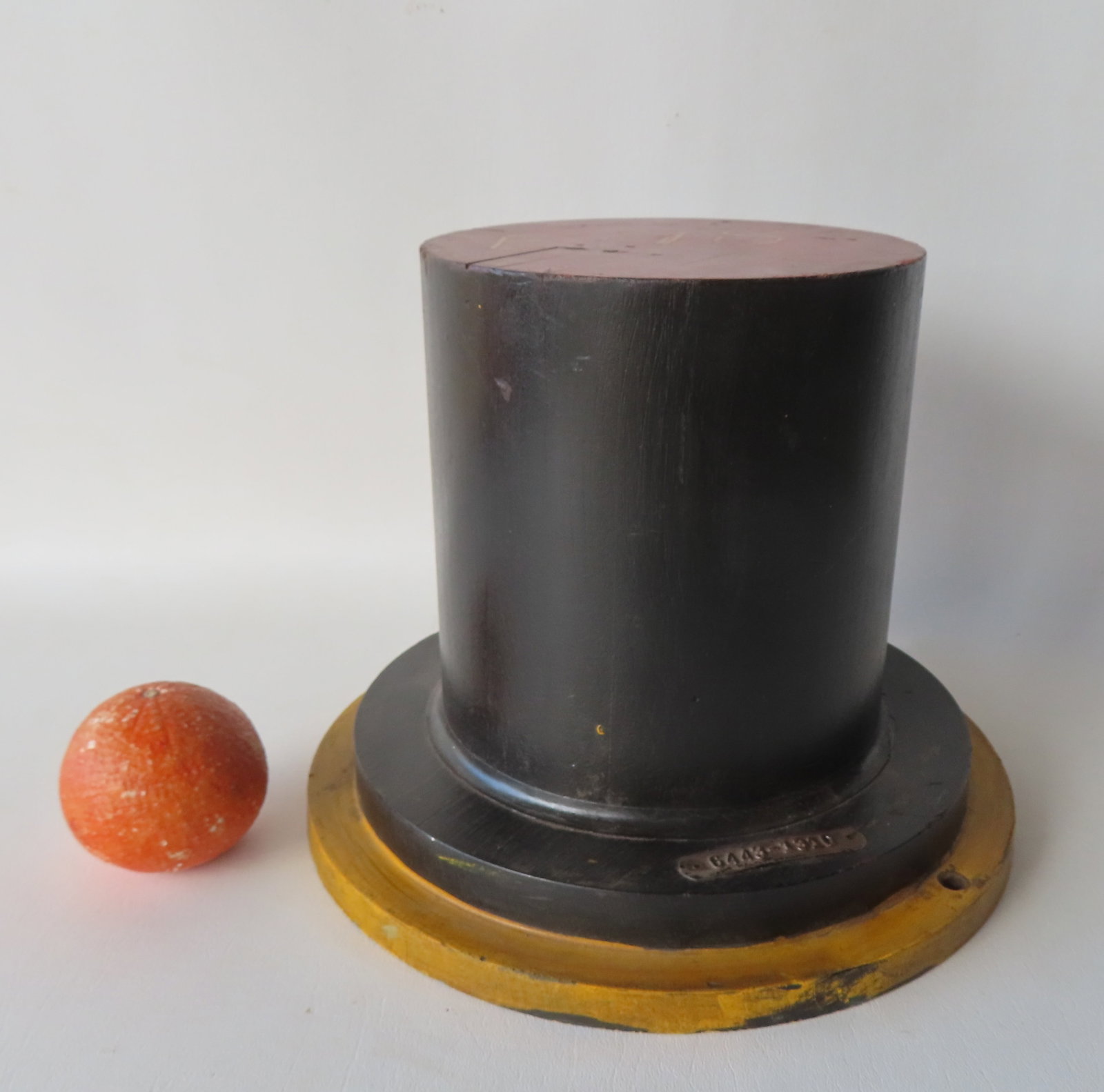 A wooden mold in the form of a top hat in original black, red and yellow paint, late 19th to early (1 of 5)