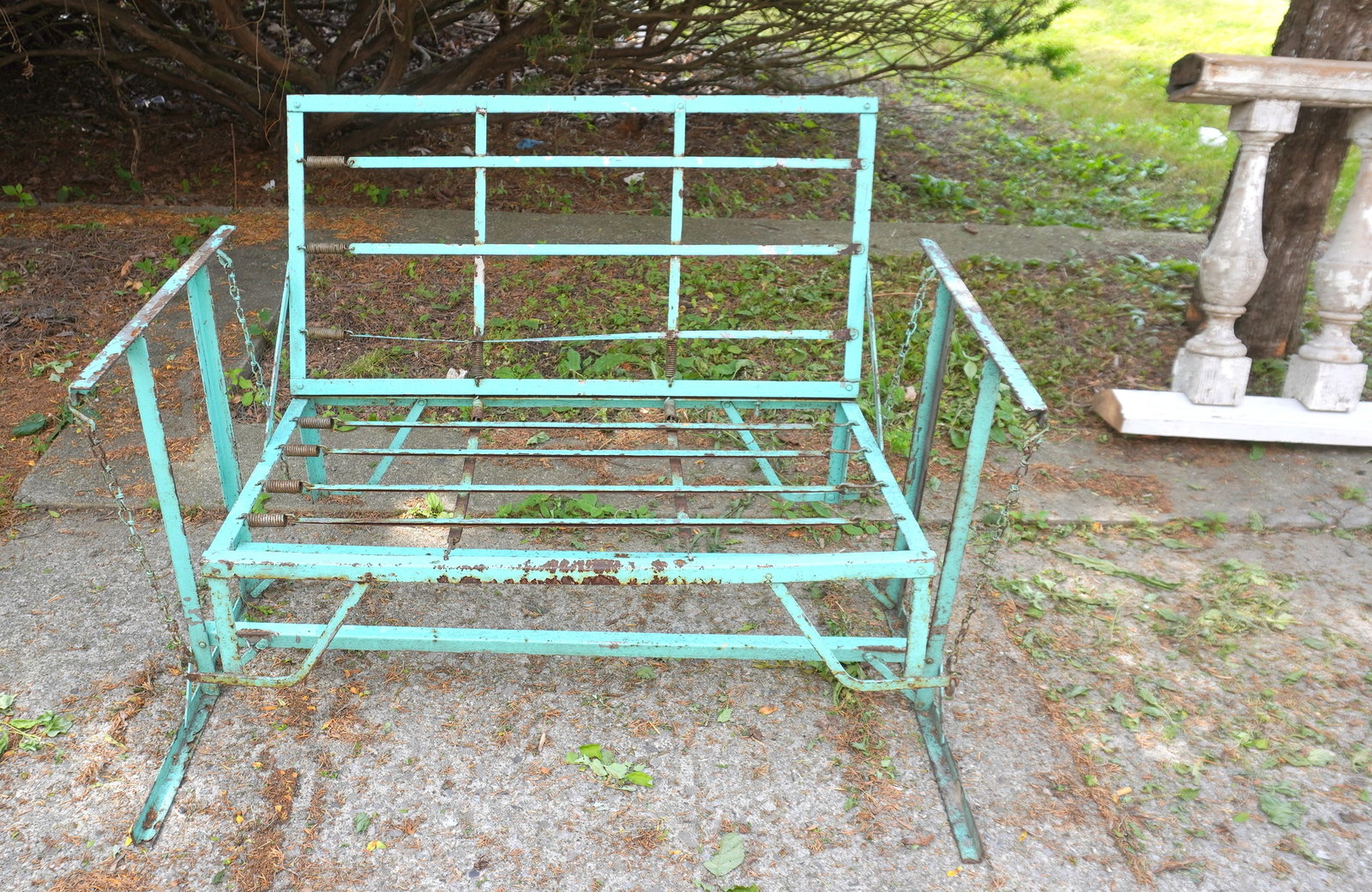 A sheet iron 2 part porch swing in old green-blue paint, good working condition. Some surface rust, (1 of 3)