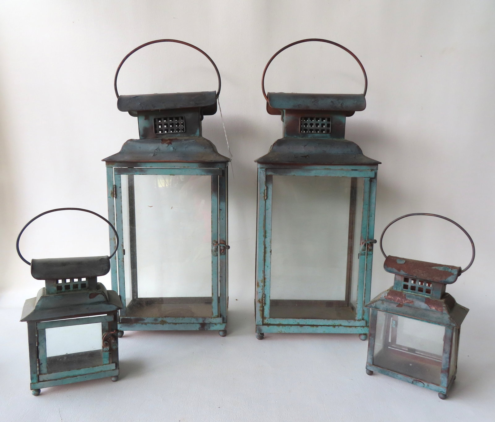 Grouping of 4 matching tin lanterns in old blue paint with vented architectural roofs, original door (1 of 5)