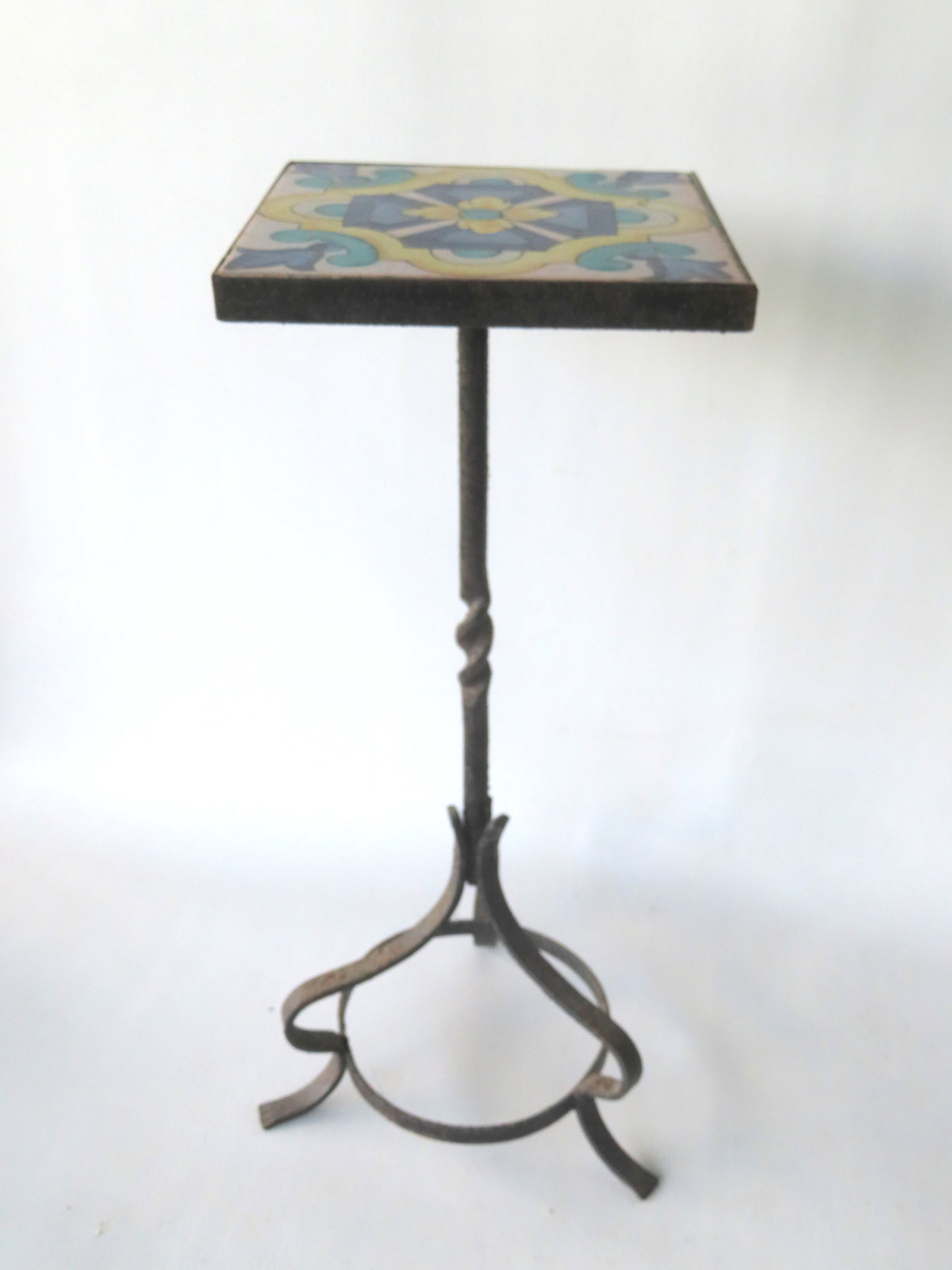 A small California Catalina plant stand with single marble top and wrought iron base with 4 scrolled: A small California Catalina plant stand with single marble top and wrought iron base with 4 scrolled legs - paint wear, otherwise good condition; together with another wrought iron plant stand with ti