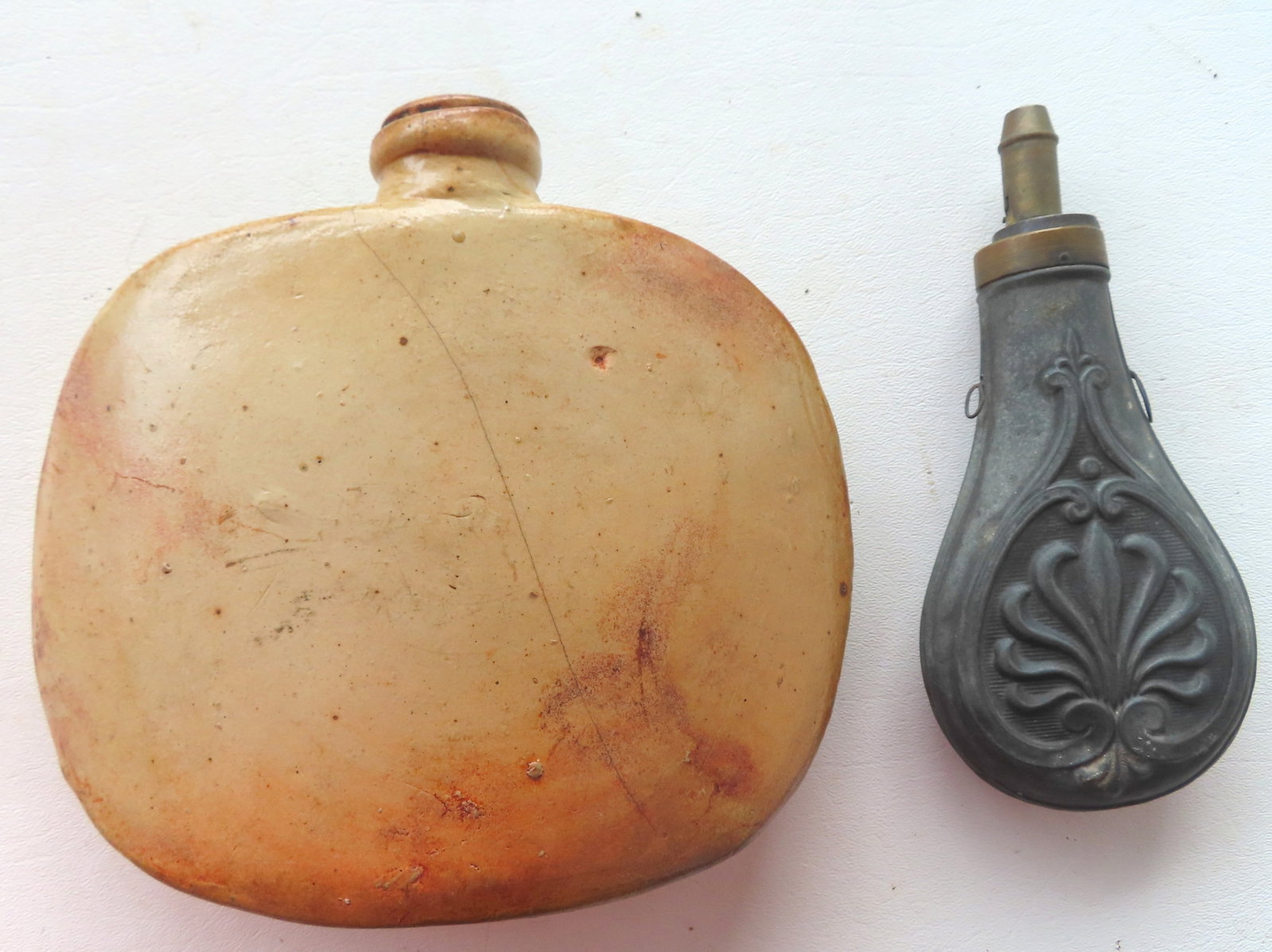 A rare Civil War era stoneware hip flask, together with a zinc shot flask, both circa 1850-70. The (1 of 8)