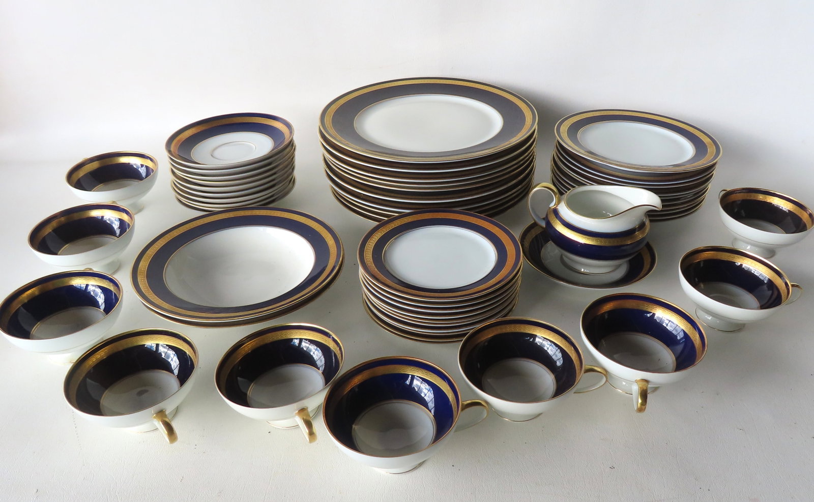 A quality dinner service for 10, Rosenthal in cobalt blue with gold bands, signed "Rosenthal / (1 of 17)