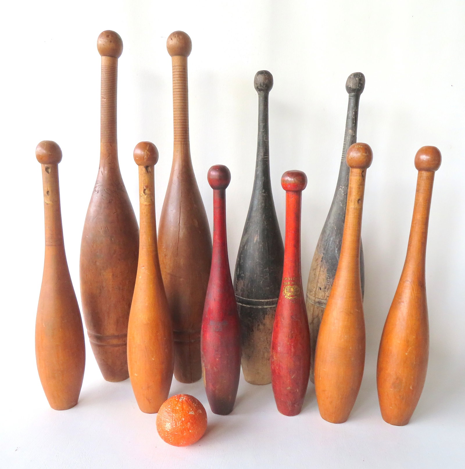 A grouping of 5 pairs of wooden dumbells, 4 matching pairs and 1 near matching pair signed Spalding (1 of 7)