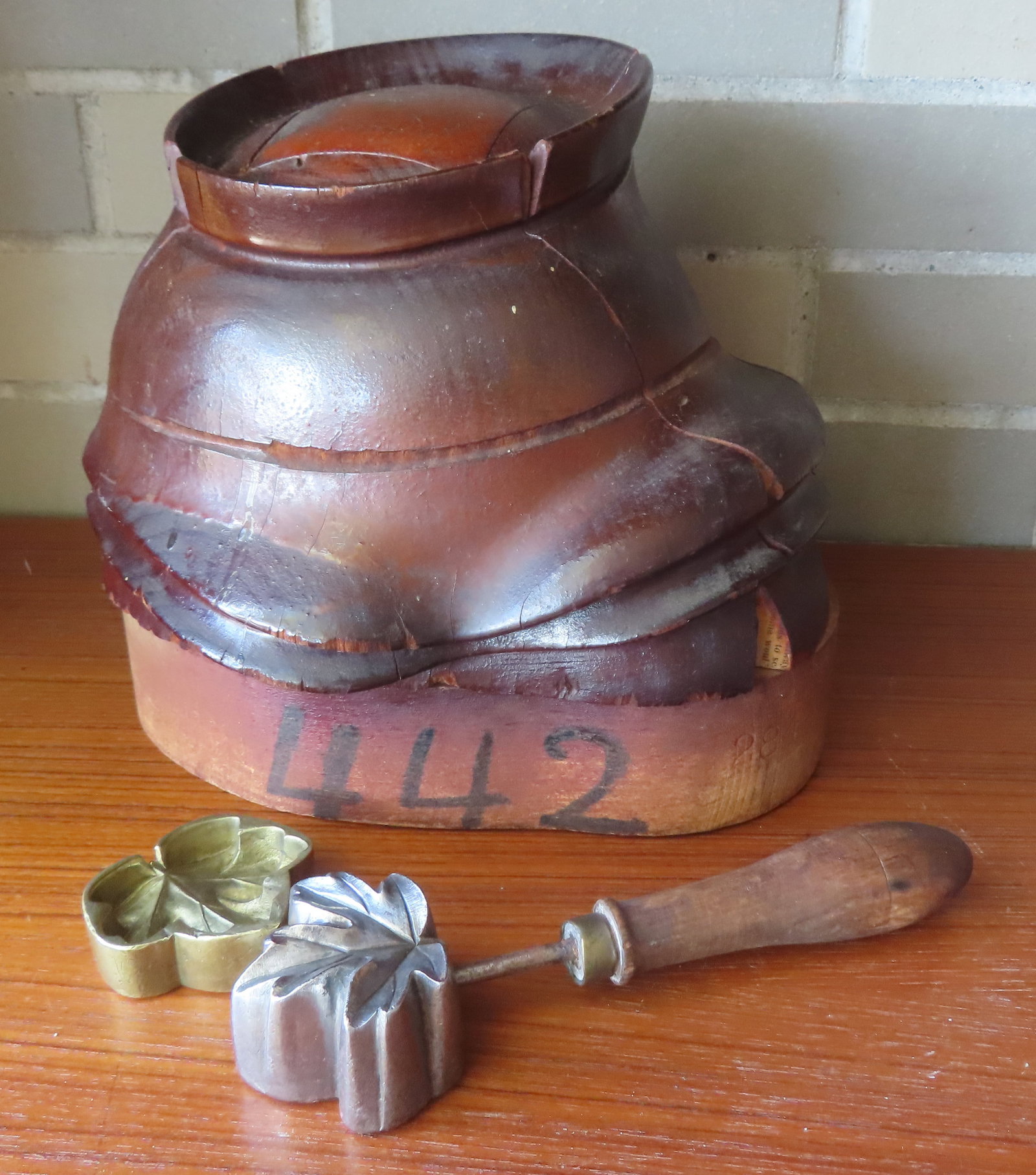 Wooden bonnet/hat sectional mold, and 2 metal millinary flower molds. The later in good condition, (1 of 11)