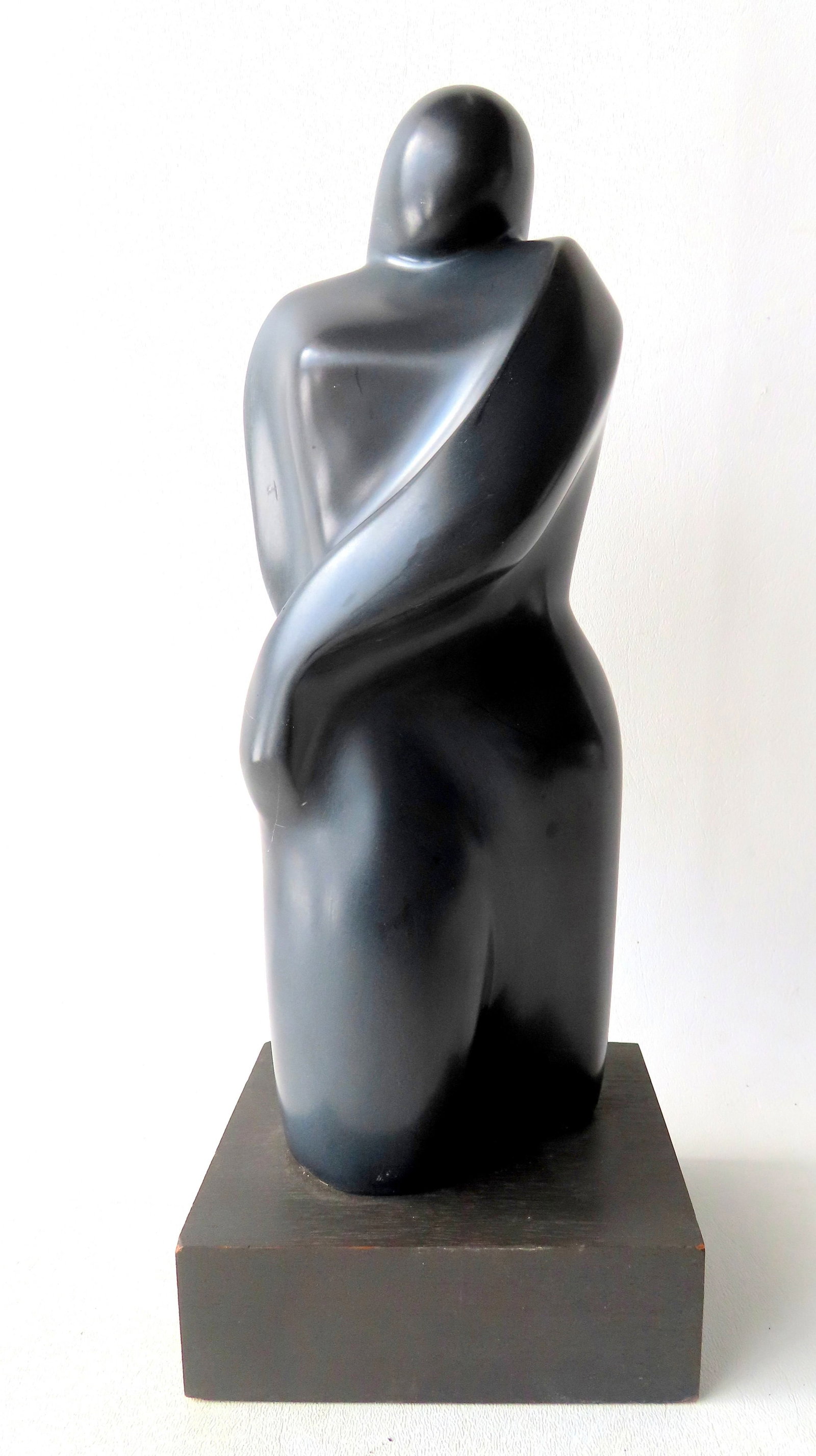 Lilly M. Tussey - Bulgarian/American, d.2005. Modernistic dark gray stone sculpture, probably: Lilly M. Tussey - Bulgarian/American, d.2005. Modernistic dark gray stone sculpture, probably marble, depicting a woman with long hair, signed "L. Tussey '75", very good condition mounted on wooden ba