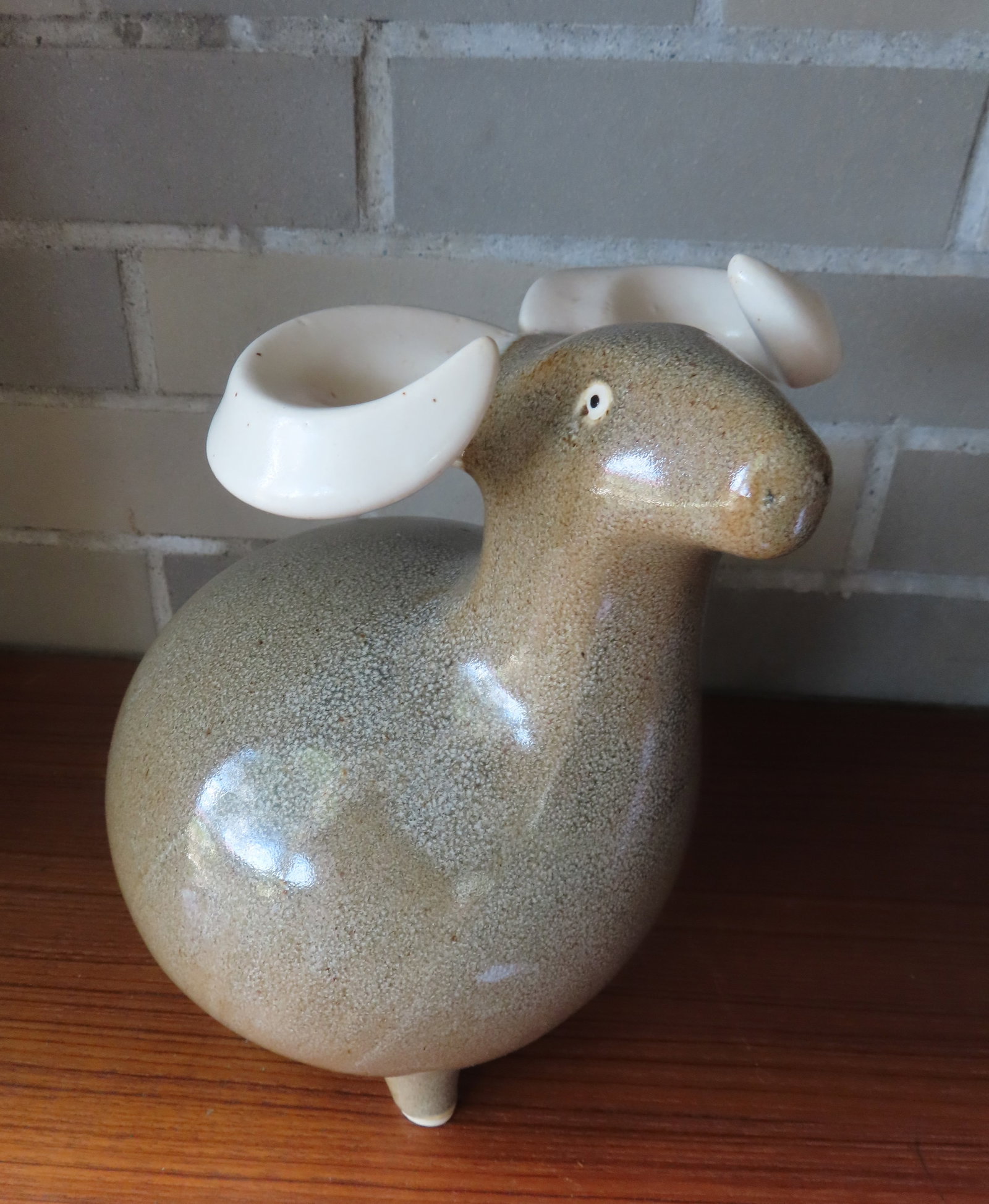 A stylized ceramic sculpture of a ram, mid to late 20th century, very good condition - unknown maker: A stylized ceramic sculpture of a ram, mid to late 20th century, very good condition - unknown maker but impressed mark in base appear to be the letter "N" within a larger "C" (or circle). Measures ap