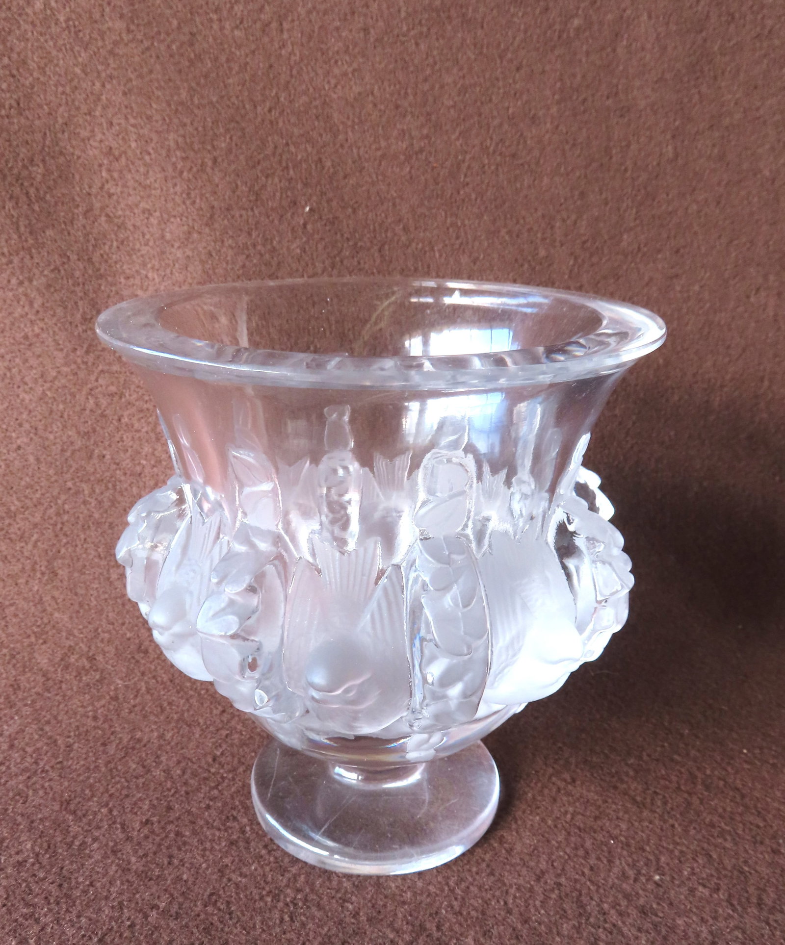 A Lalique Dampierre Vase signed on underside of base "Lalique / France". The vase decorated with (1 of 4)