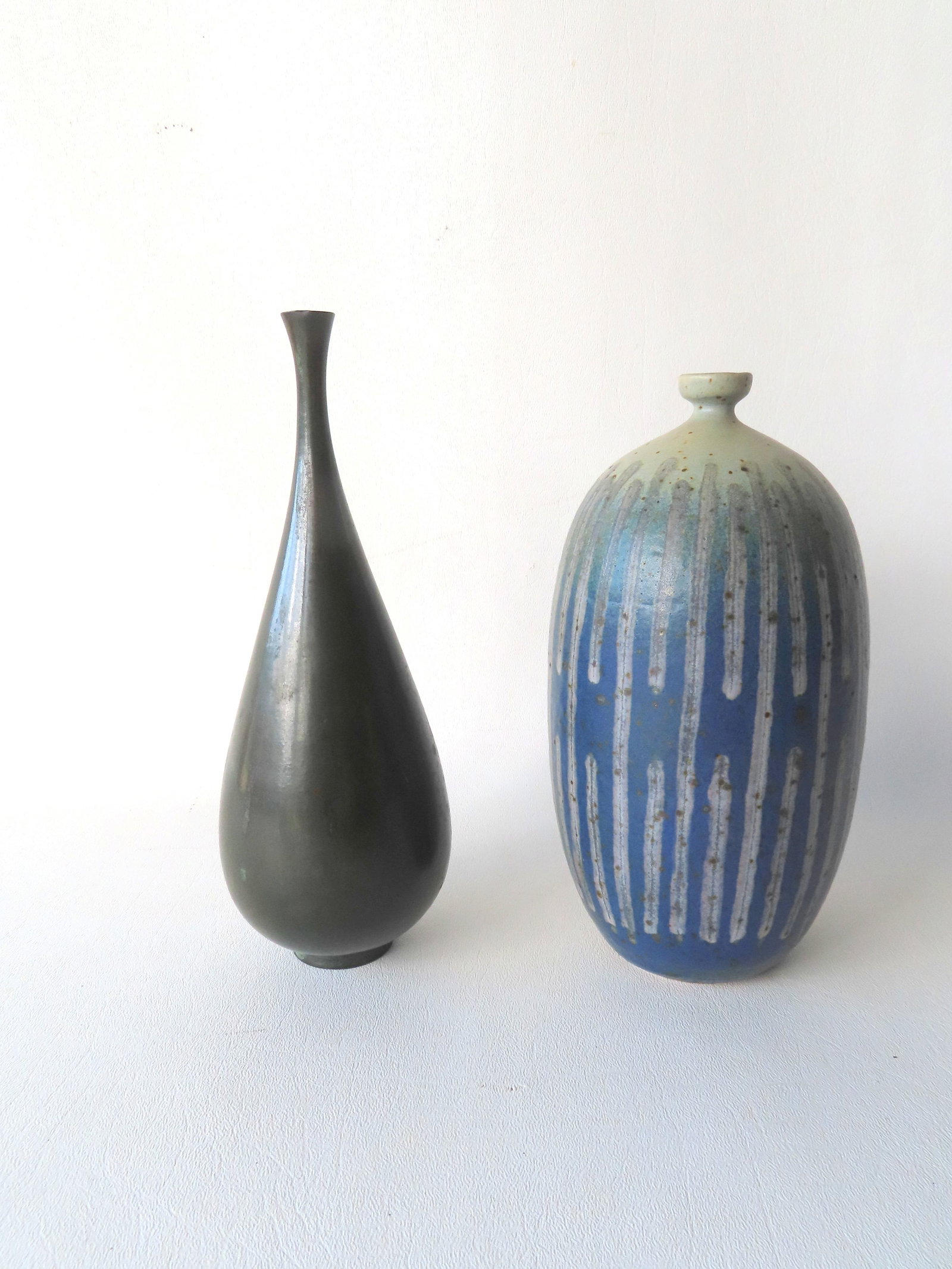 Two oriental style bud vases. The first, ceramic studio pottery, in modernistic style decorated with (1 of 9)