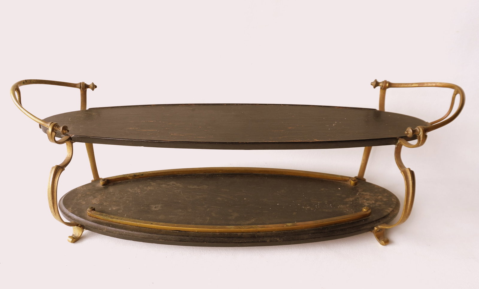 An unusual Arts & Crafts style oval ebonized oak display stand with 2 shelves and shaped brass (1 of 8)