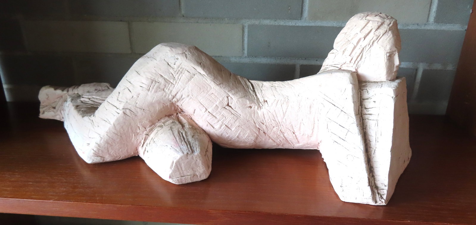 A modernistic terra cotta sculpture of a reclining lady, circa 1970 - very good condition - measures: A modernistic terra cotta sculpture of a reclining lady, circa 1970 - very good condition - measures 22 1/2"L x 8"W x 7"H. Provenance: From the Marni Bakst and William Sadler collection of antiques, V