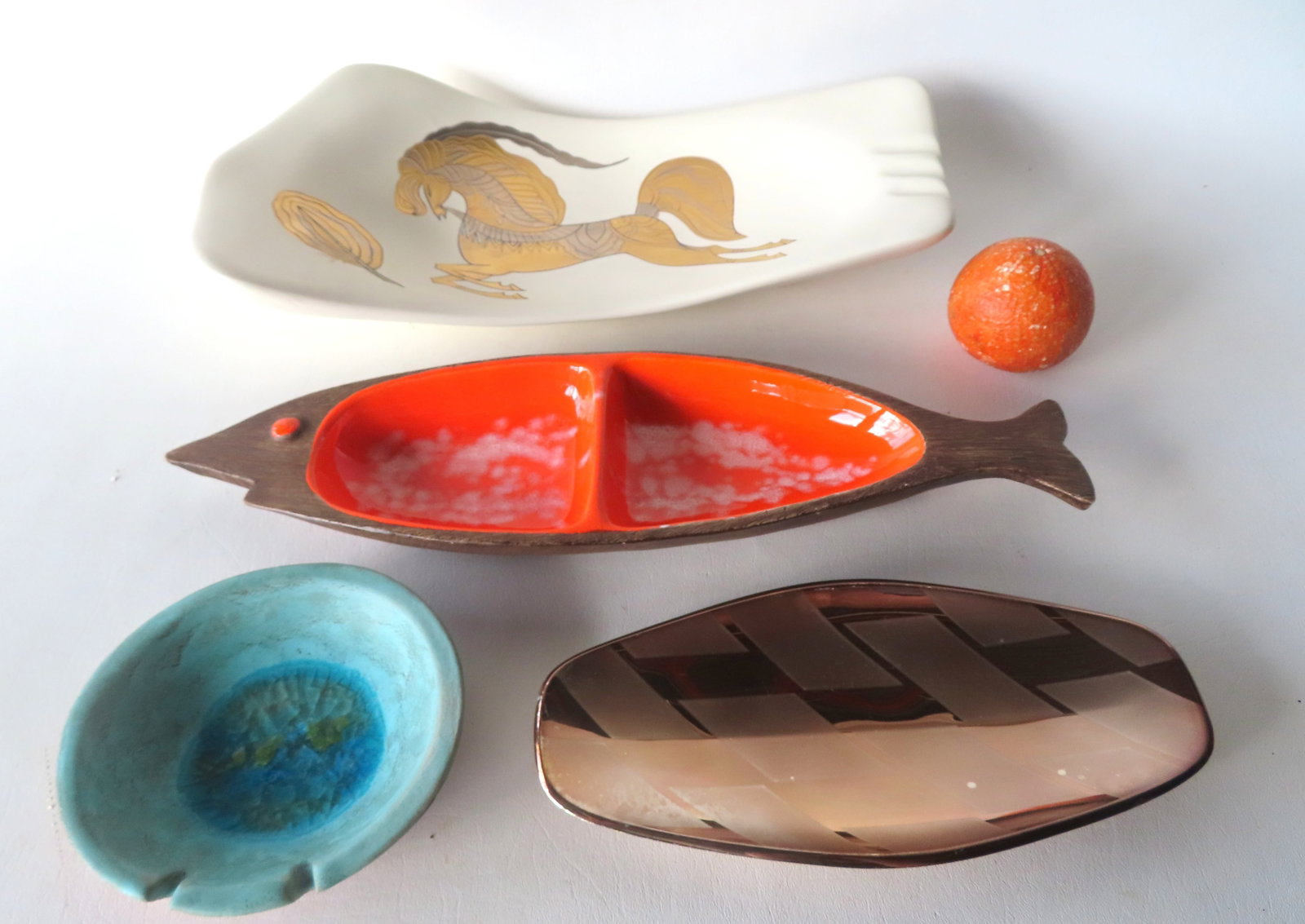 Grouping of 4 pieces of mid-century modern ceramics including: Large porcelain white serving: Grouping of 4 pieces of mid-century modern ceramics including: Large porcelain white serving platter, decorated with a stylized gold & silver horse and quill signed by artist Sascha B. (Sascha Brastof