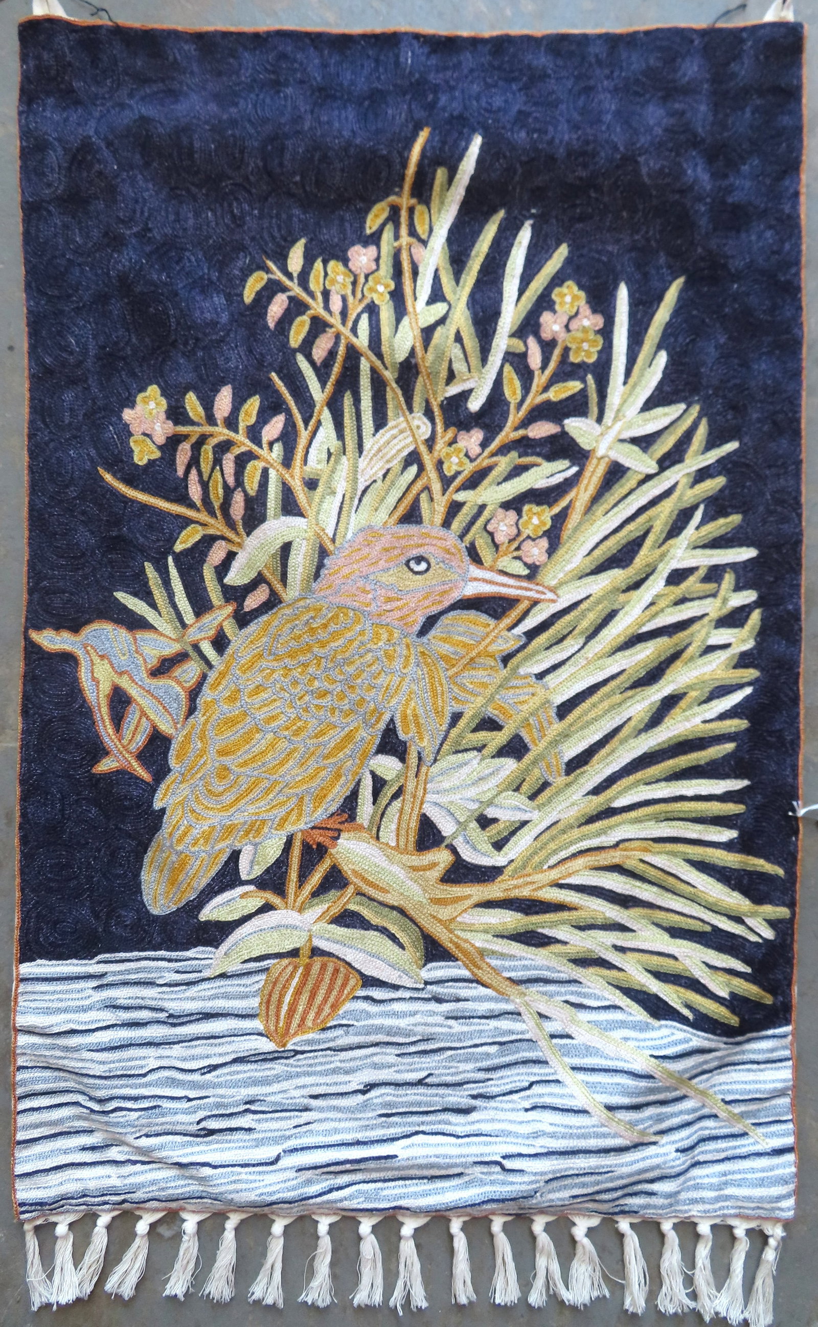 A hand crocheted wall hanging colorful textile depicting a shorebird in flowering marsh, mid 20th (1 of 5)